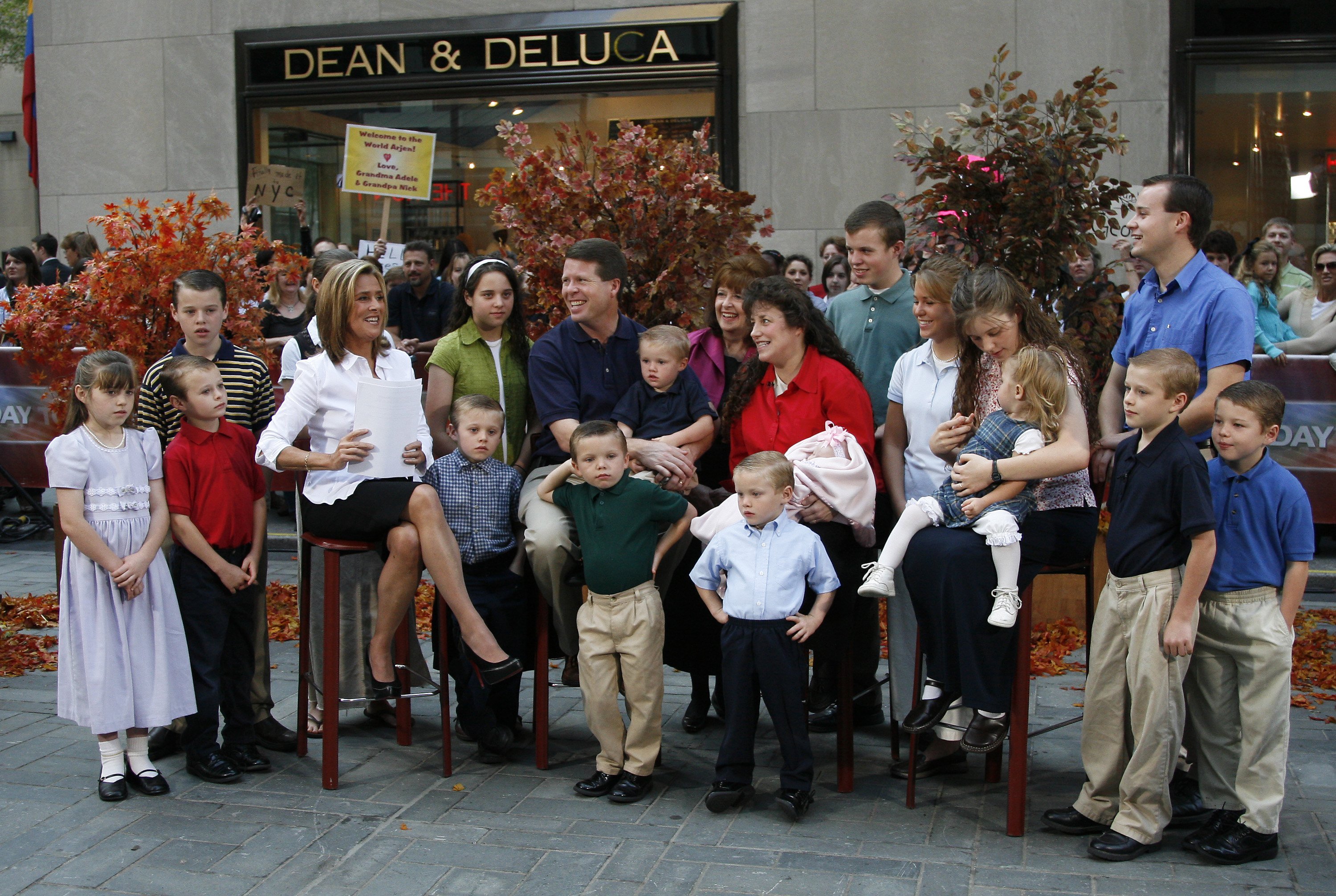 Members of the Duggar family standing outside a Dean & Deluca in 2007