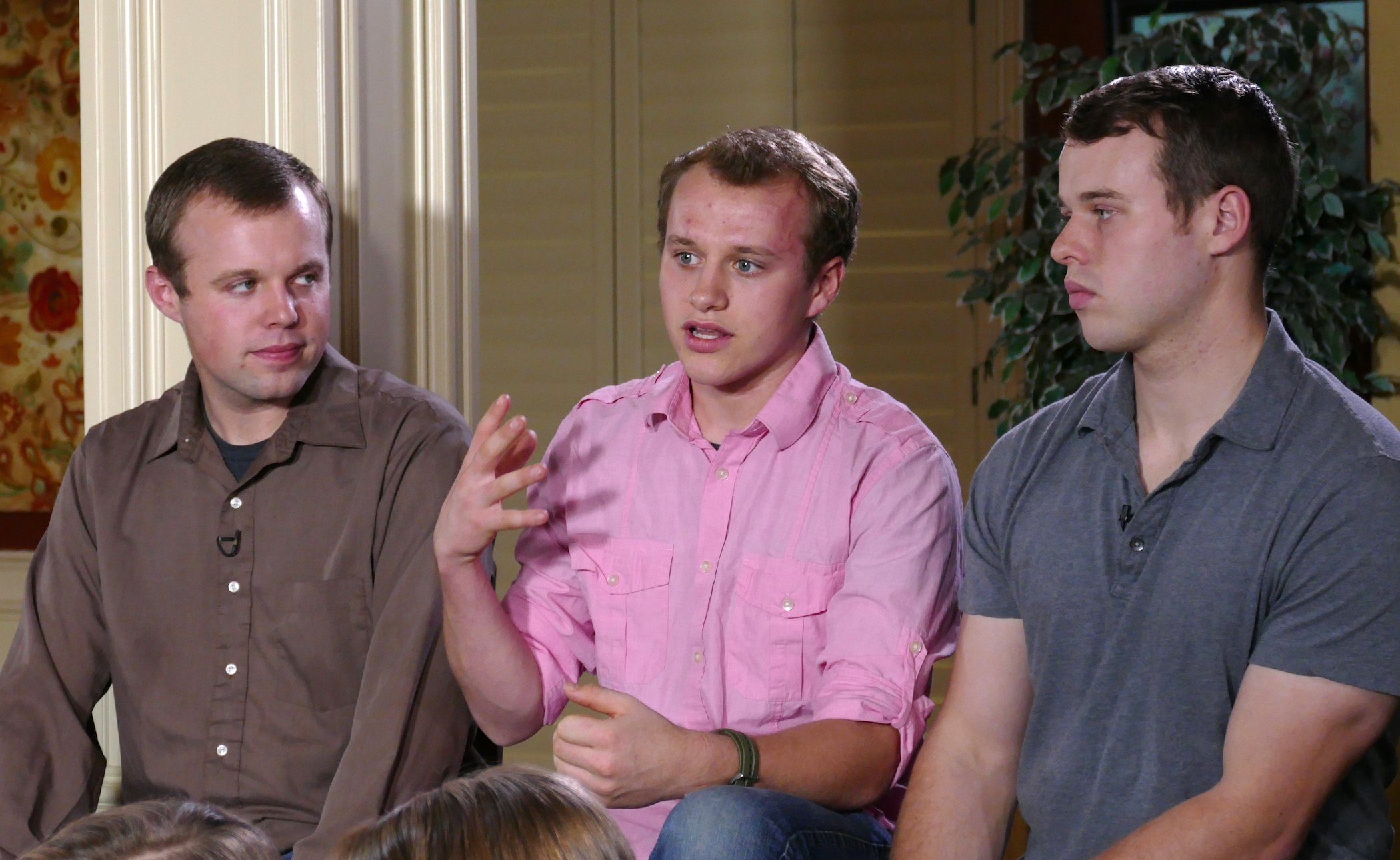 John David, Josiah, and Joseph Duggar of the Duggar family sitting and talking to an interviewer