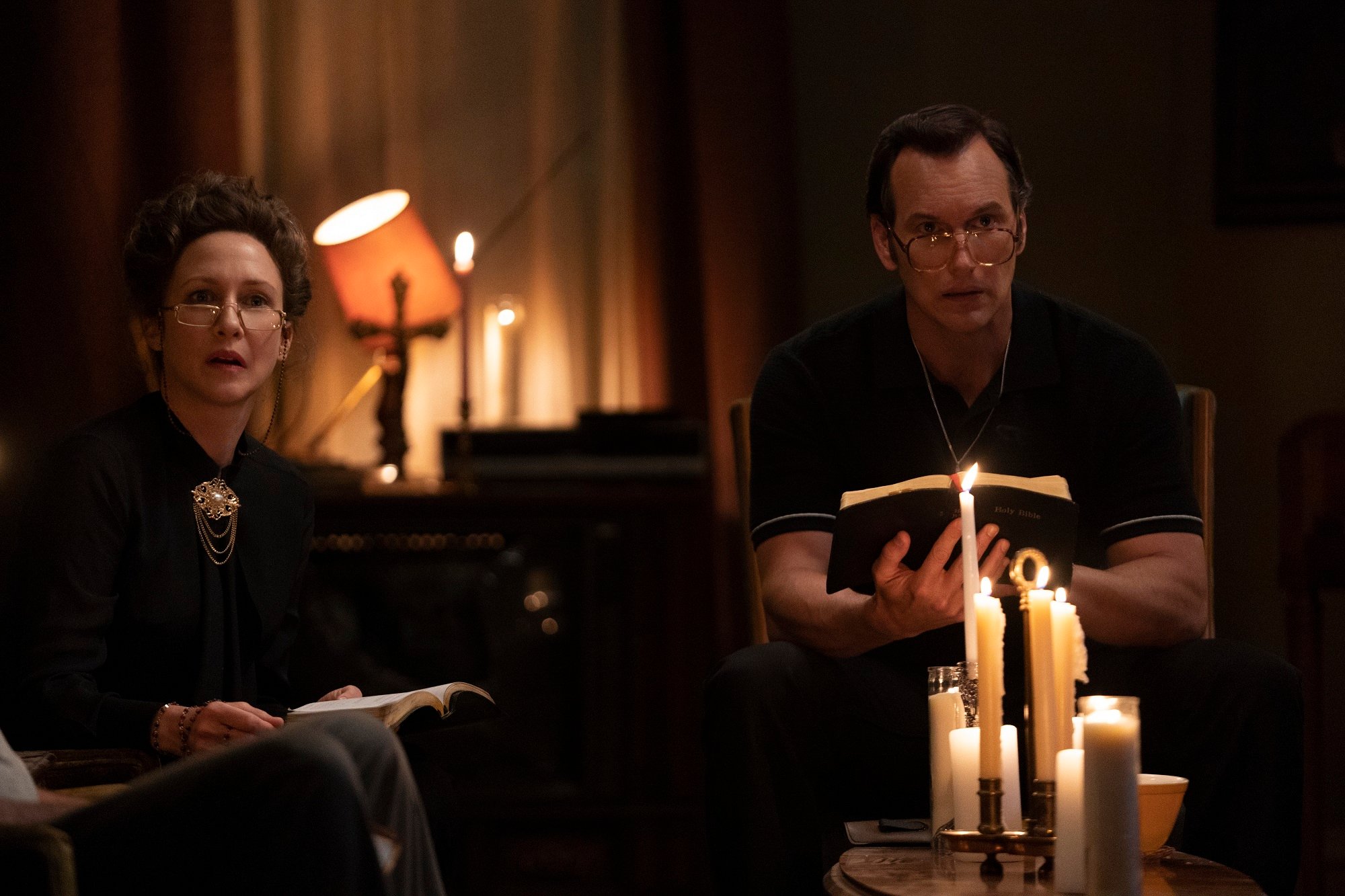Ed and Lorraine Warren pray by candlelight
