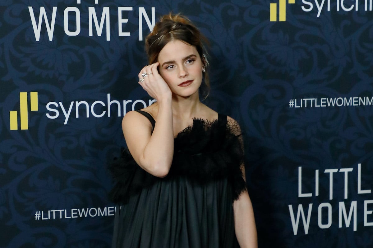 Harry Potter alum Emma Watson in a black dress and dark red lipstick