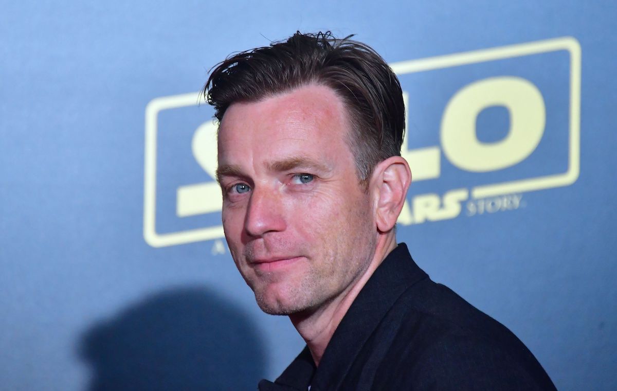 Ewan McGregor wears black and smiles at the 'Solo: A Star Wars Story' premiere