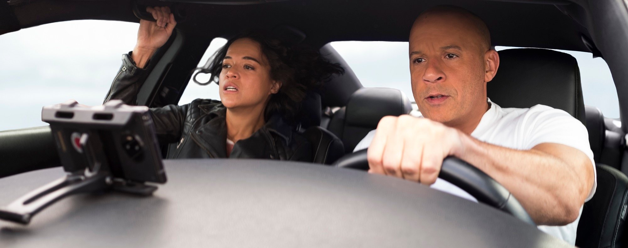 F9: Vin Diesel behind the wheel and Michelle Rodriguez in the passenger seat