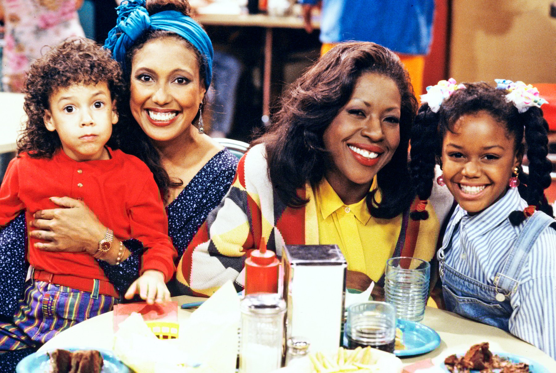 Telma Hopkins holding Bryton McClure and Jo Marie Payton and Jaimee Foxworth smiling