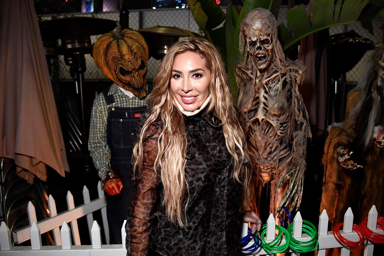 Farrah Abraham age 29 wears a lacy black gown and a face mask under her chin