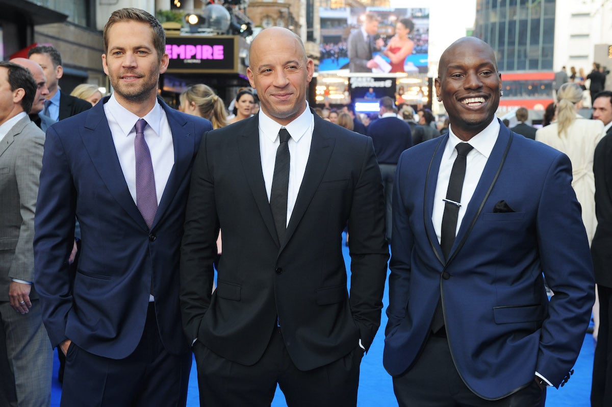 ‘Fast & Furious 6’ stars Paul Walker, Vin Diesel, and Tyrese Gibson wear suits and smile at the movie’s premiere