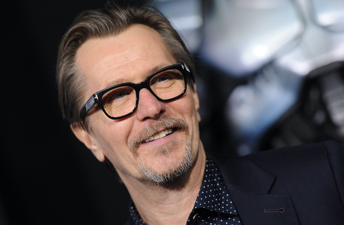 Gary Oldman smiles at a red carpet event