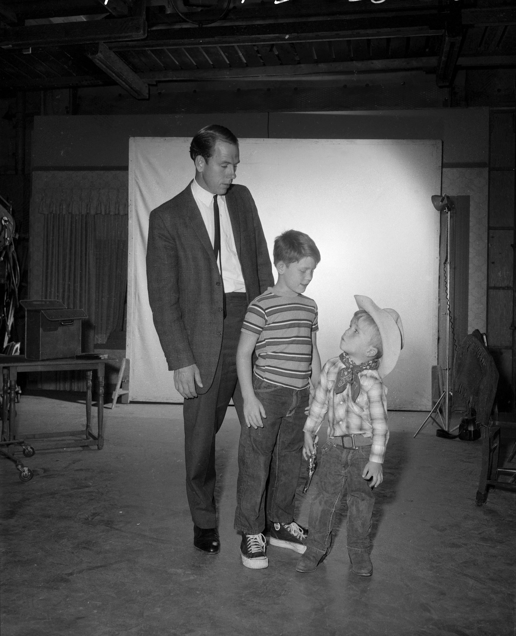 (left to right): Rance Howard with his sons, actors Ron Howard and Clint Howard on 'The Andy Griffith Show' set in 1963