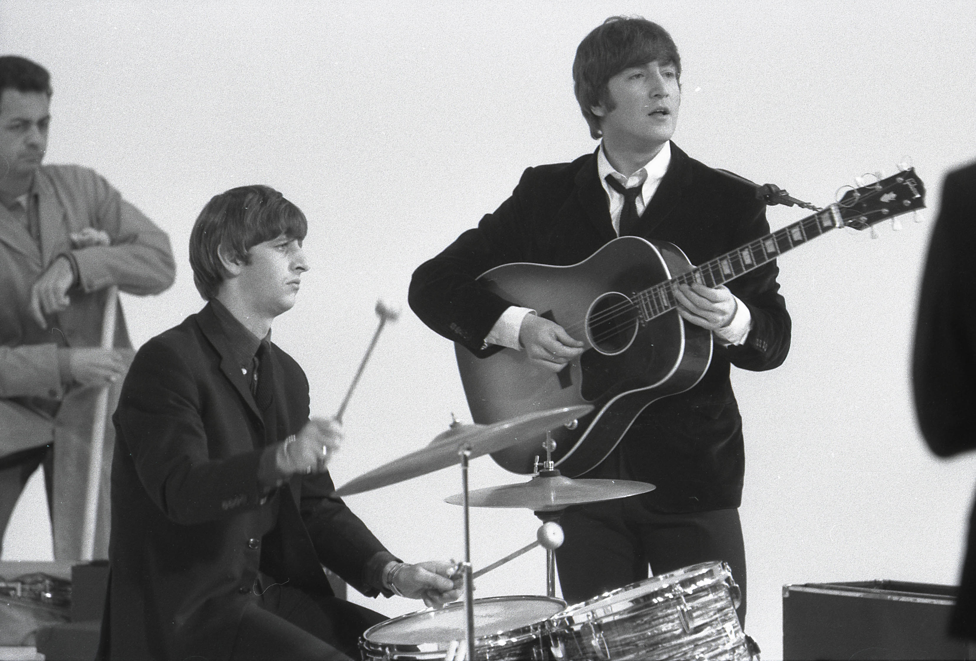 Ringo Starr, left, and John Lennon perform during the filming of 1964's 'A Hard Day's Night'