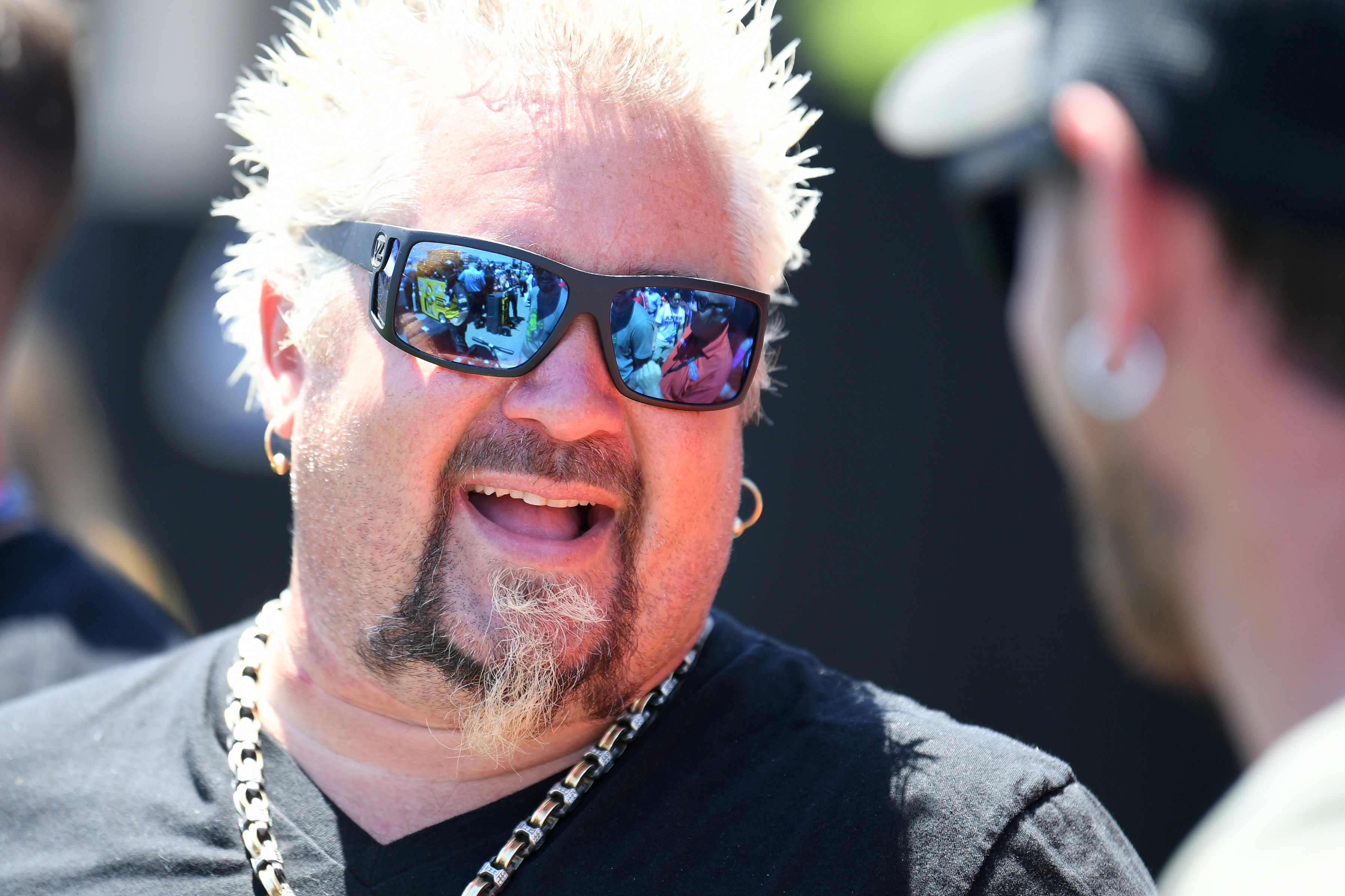 Celebrity chef Guy Fieri hangs out during qualifying for the Monster Energy NASCAR Cup Series Toyota/Save Mart 350 at Sonoma Raceway on June 22, 2019 in Sonoma, California. 