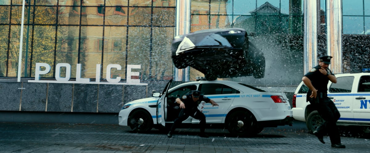 Infinite: A car drives through the police station 