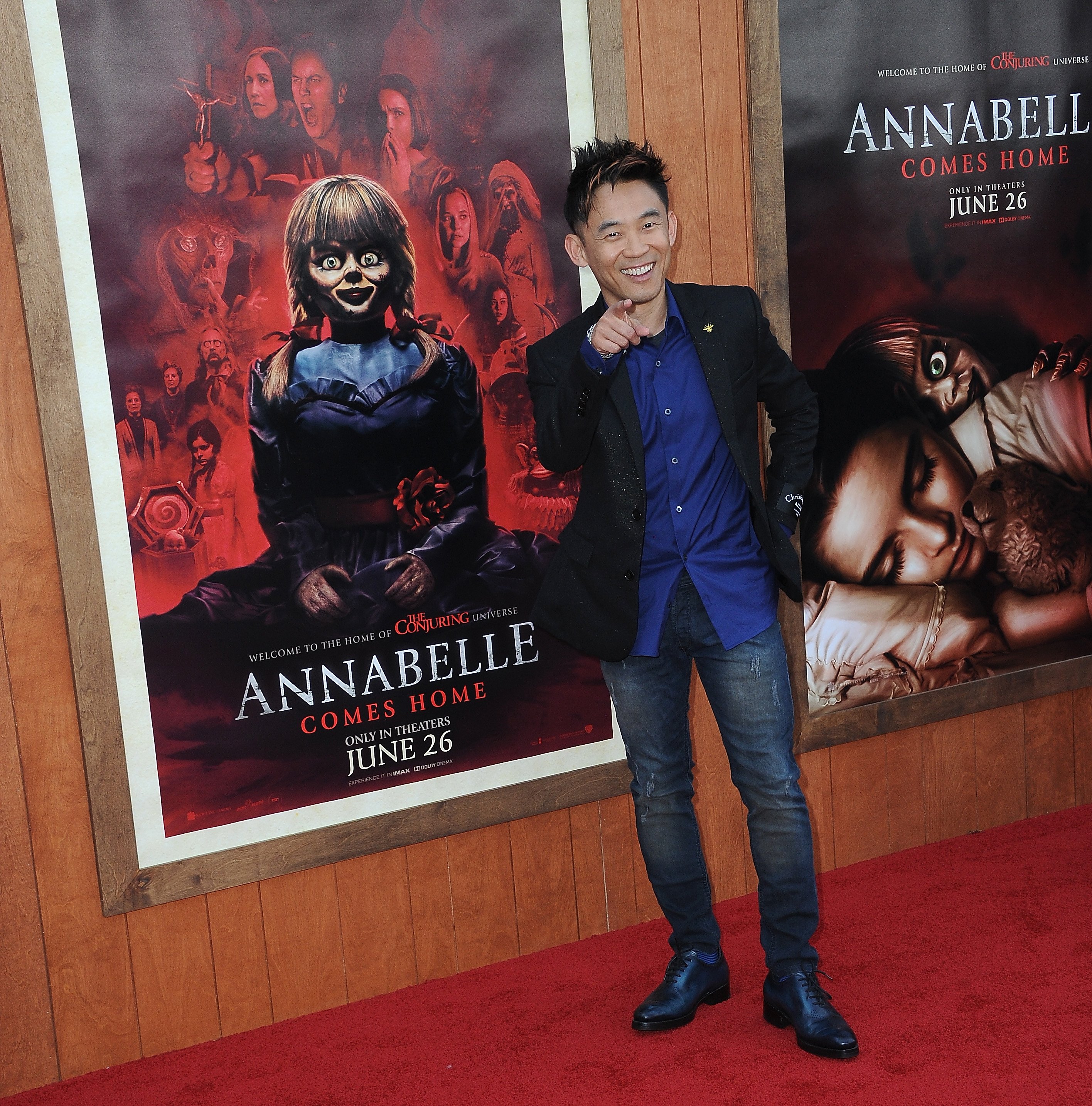 James Wan points on the red carpet for Annabelle Comes Home