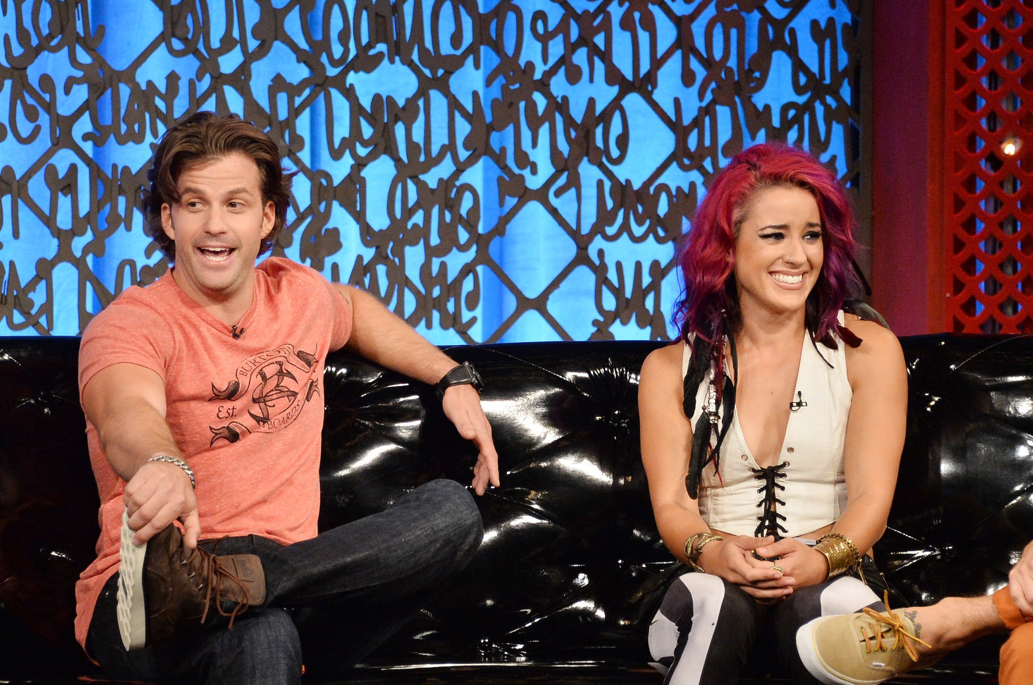 Cara Maria Sorbello sitting next to Johnny 'Bananas' Devenanzio on a couch at MTV's 'The Challenge: Rivals II' final episode and reunion party