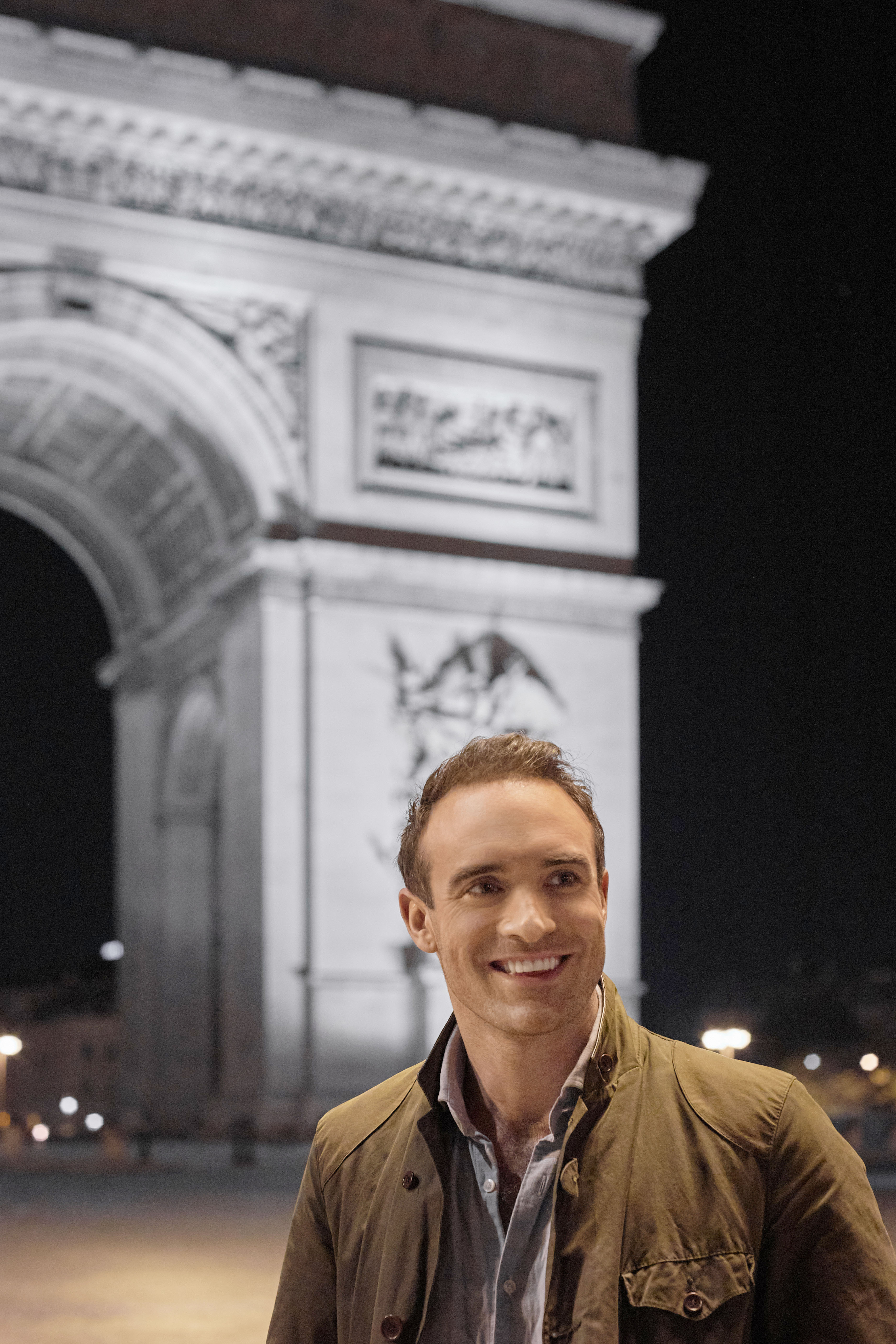 Joshua Sasse in front of the Arc de Triomphe in 'Her Pen Pal'