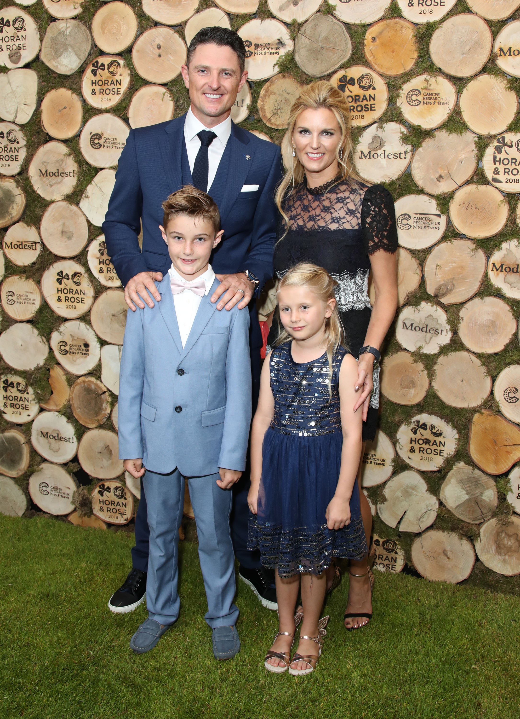 Justin Rose and Kate Phillips Rose attend the Horan And Rose Charity Event held at The Grove with their children