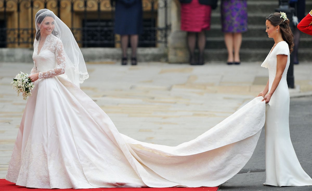 The iconic Kate Middleton wedding dress is still popular after years. Pictured here, Pippa Middleton holds Kate's bridal train.