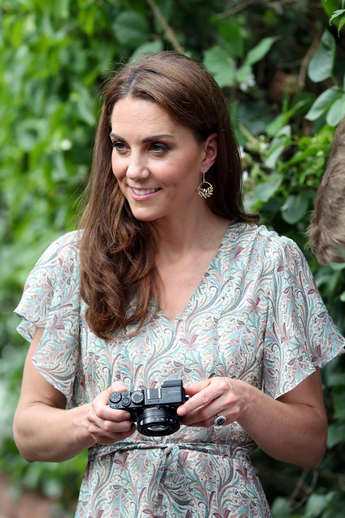 Kate Middleton holds a camera as she takes part in a 2019 charity photography workshop