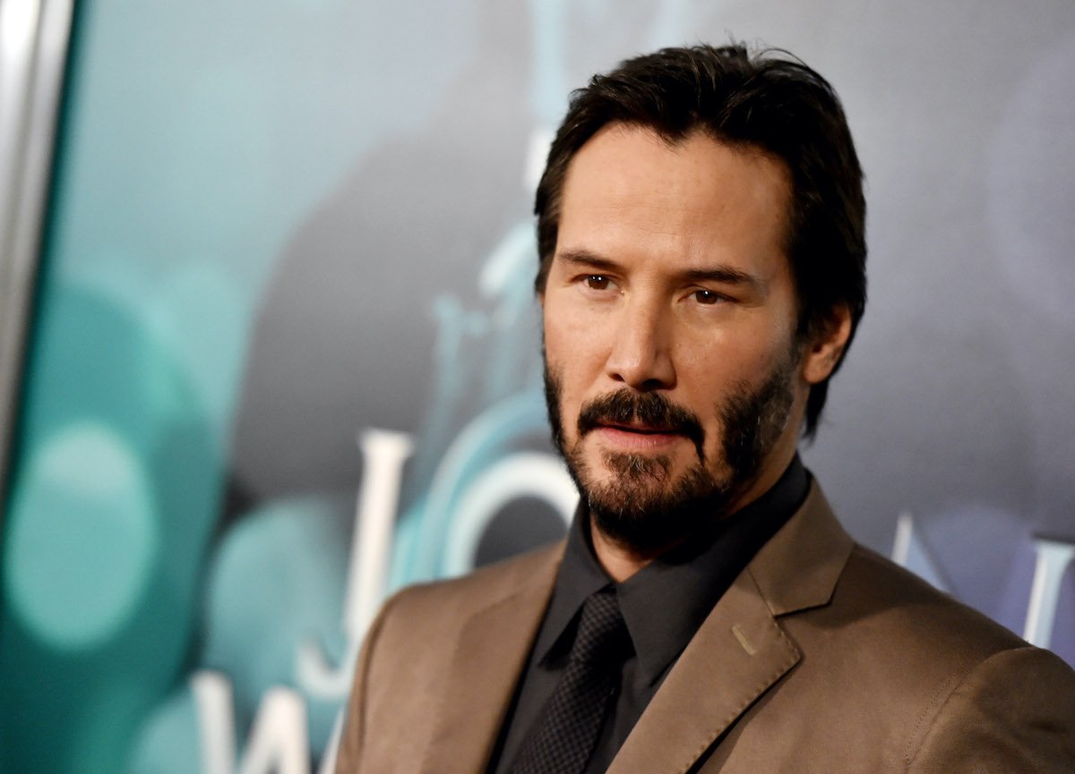 Keanu Reeves wears a suit at a screening of 'John Wick'