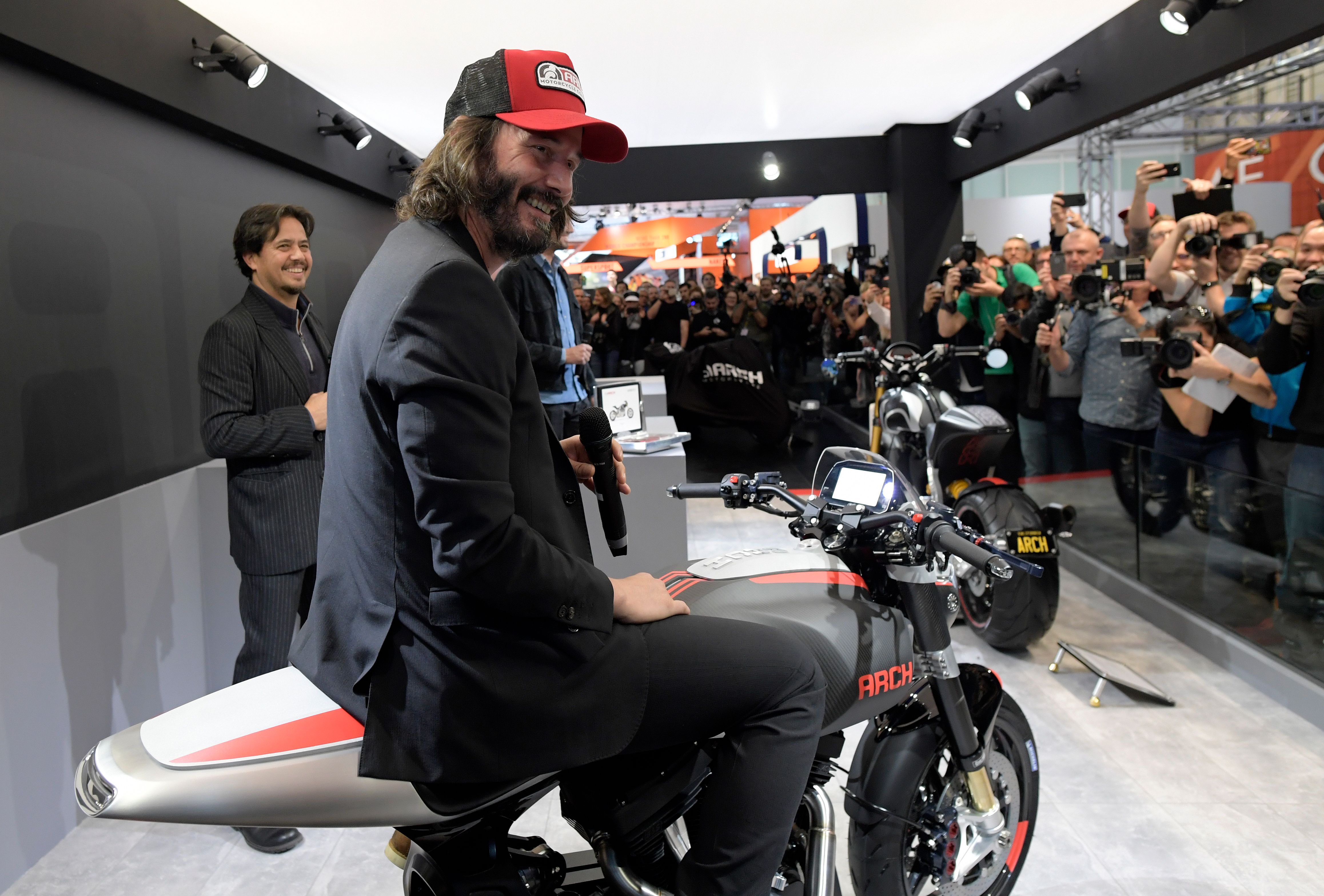 Keanu Reeves and Gard Hollinger display an Arch motorcycle