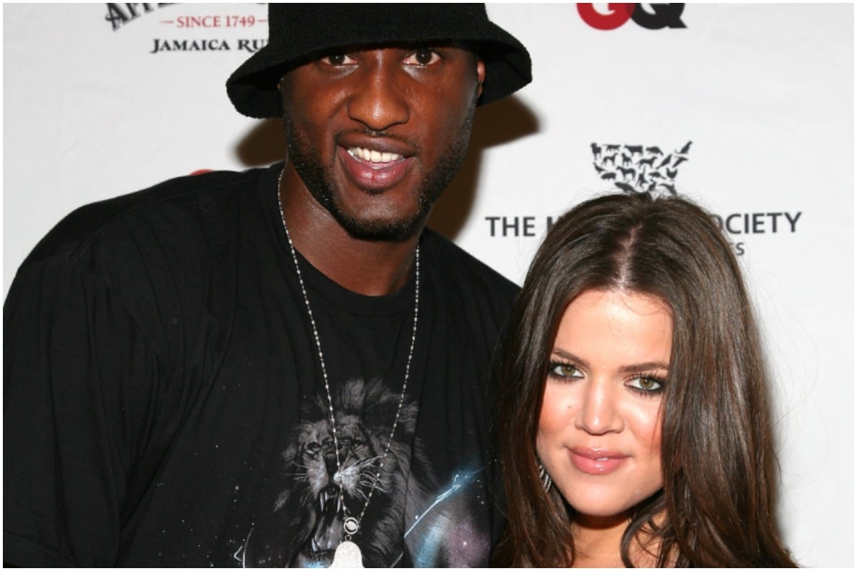 Khloé Kardashian and Lamar Odom smiling and posing at a red carpet event.