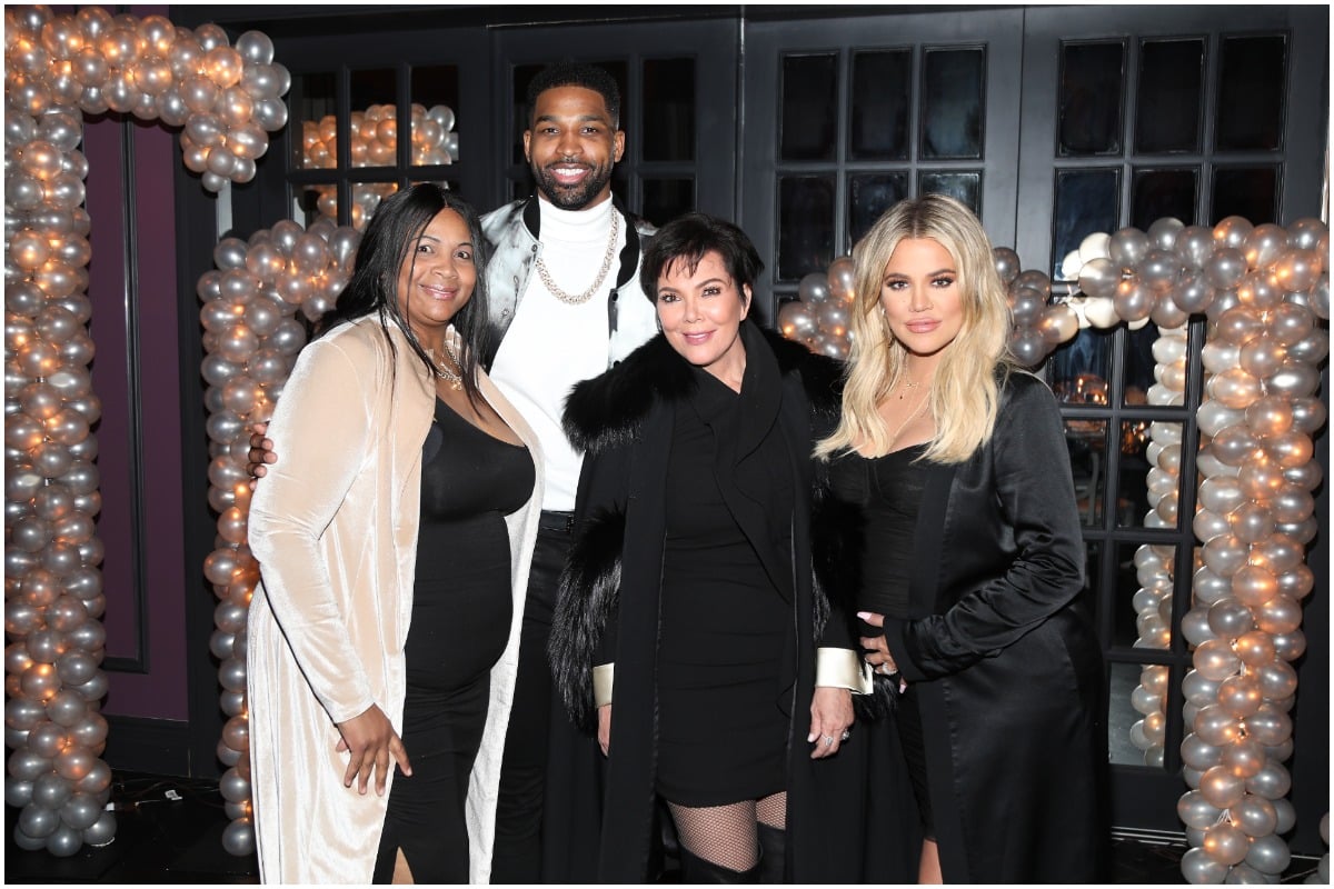 (L-R) Andrea Thompson, Tristan Thompson, Kris Jenner and Khloé Kardashian posing and smiling at the athete's birthday party.