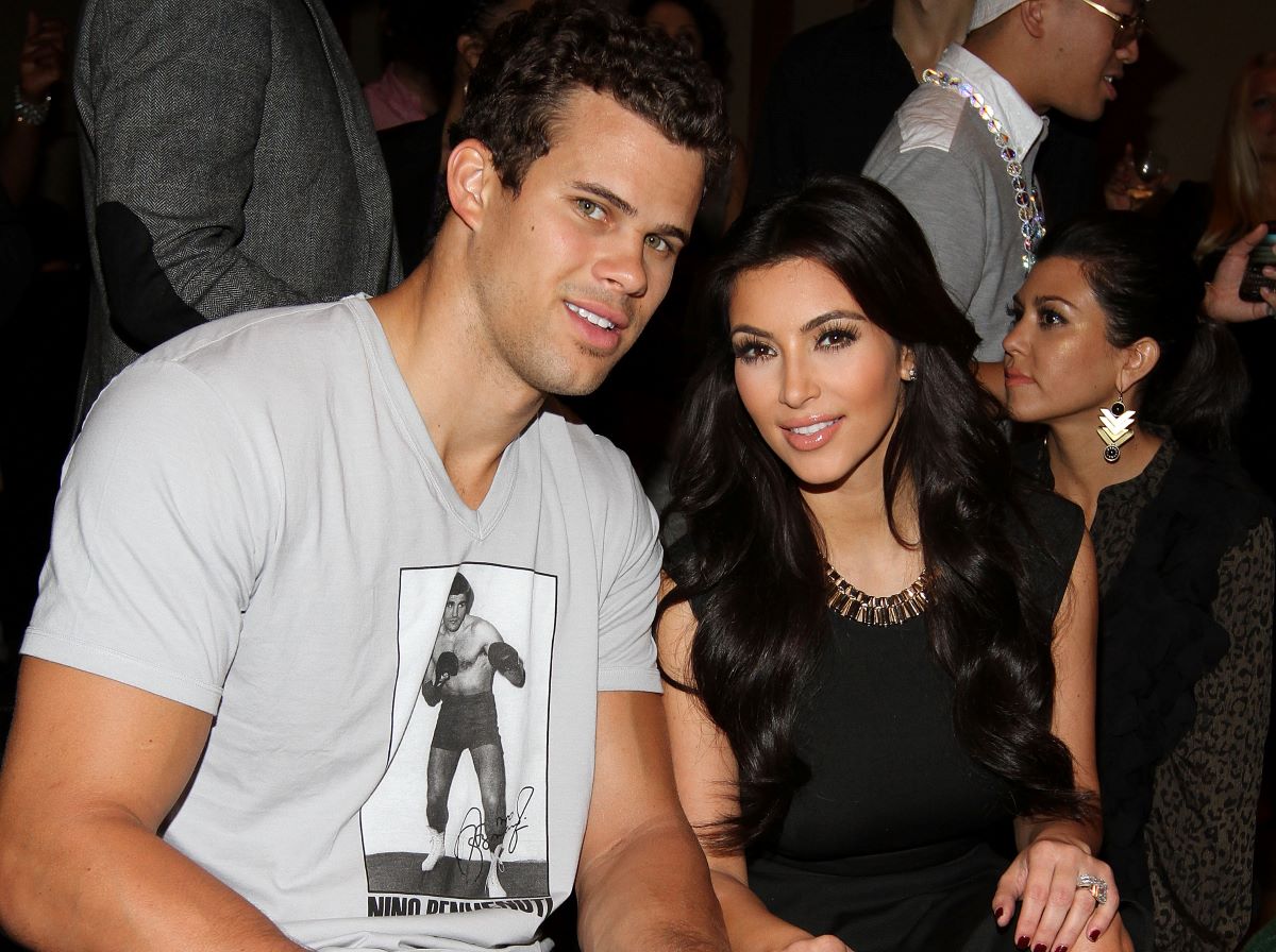 Kris Humphries in a t-shirt and Kim Kardashian West in a black shirt