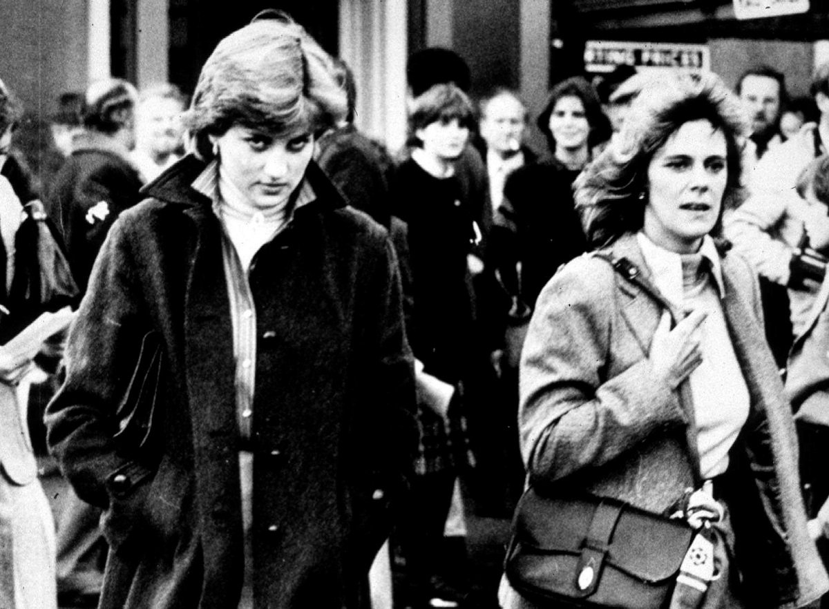 Lady Diana Spencer and Camilla Parker-Bowles walking side-by-side at the Ludlow Races where Prince Charles was competing in 1980