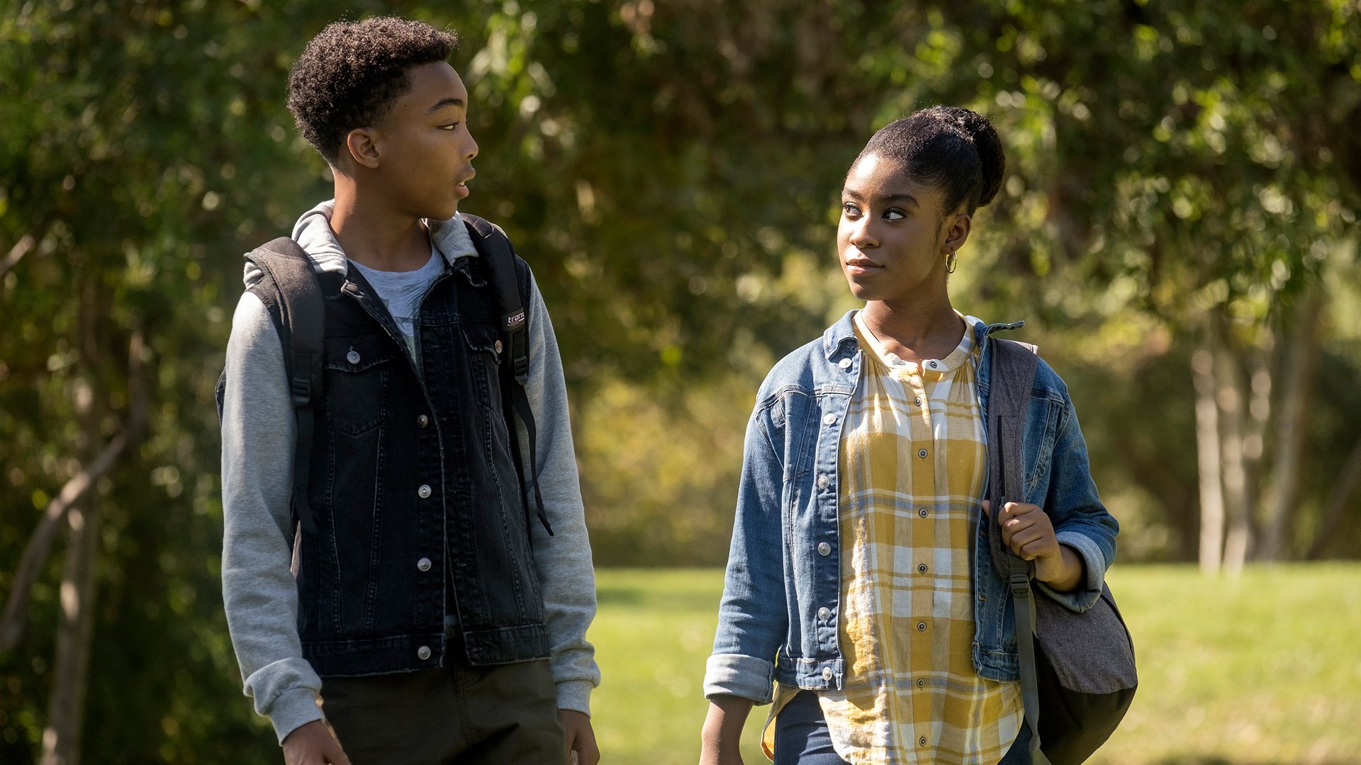 Asante Blackk as Malik and Lyric Ross as Deja walk together in ‘This Is Us’ Season 4 Episode 7