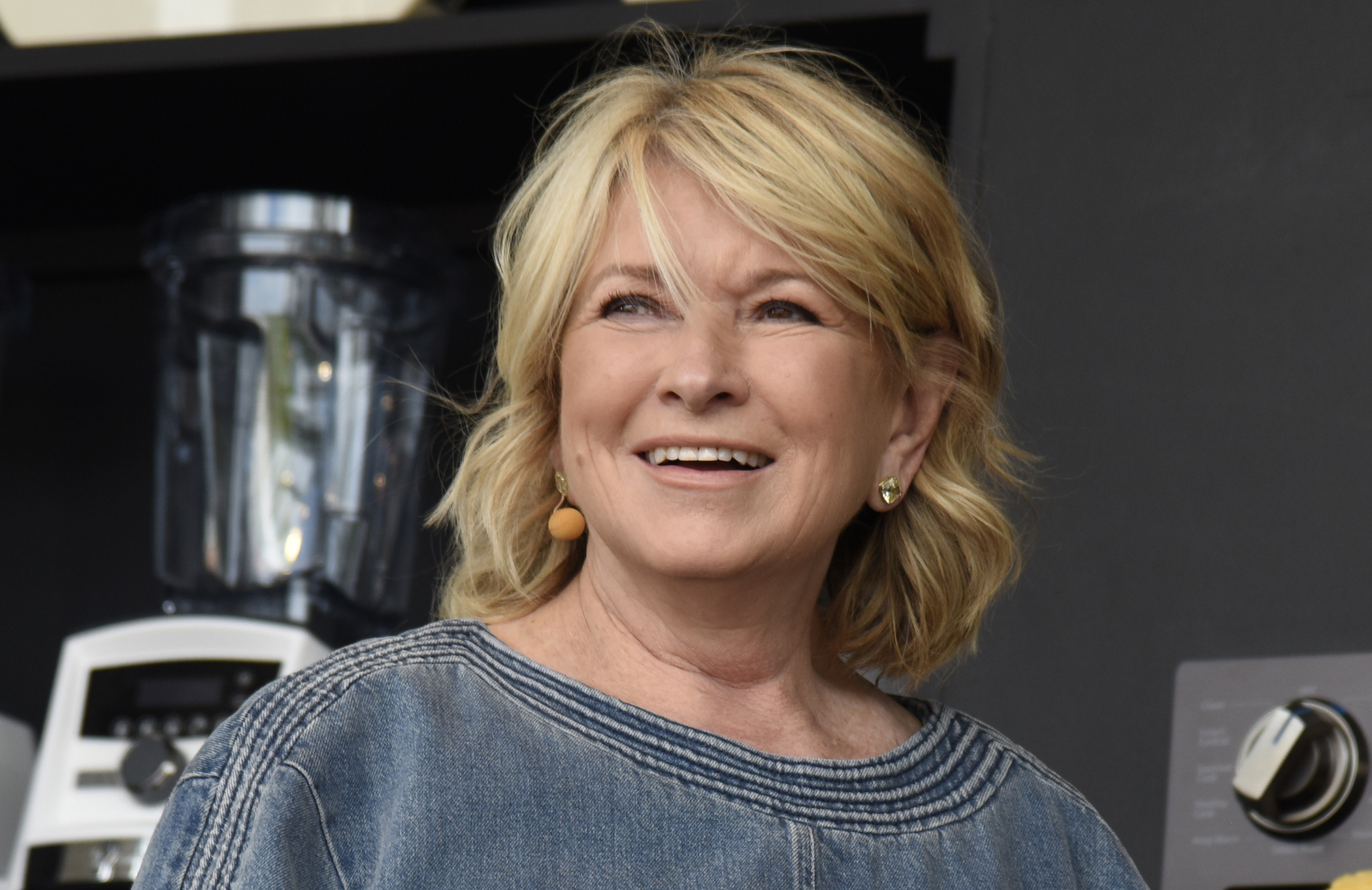 A close-up of Martha Stewart as she shares her recipes at a cooking demonstration