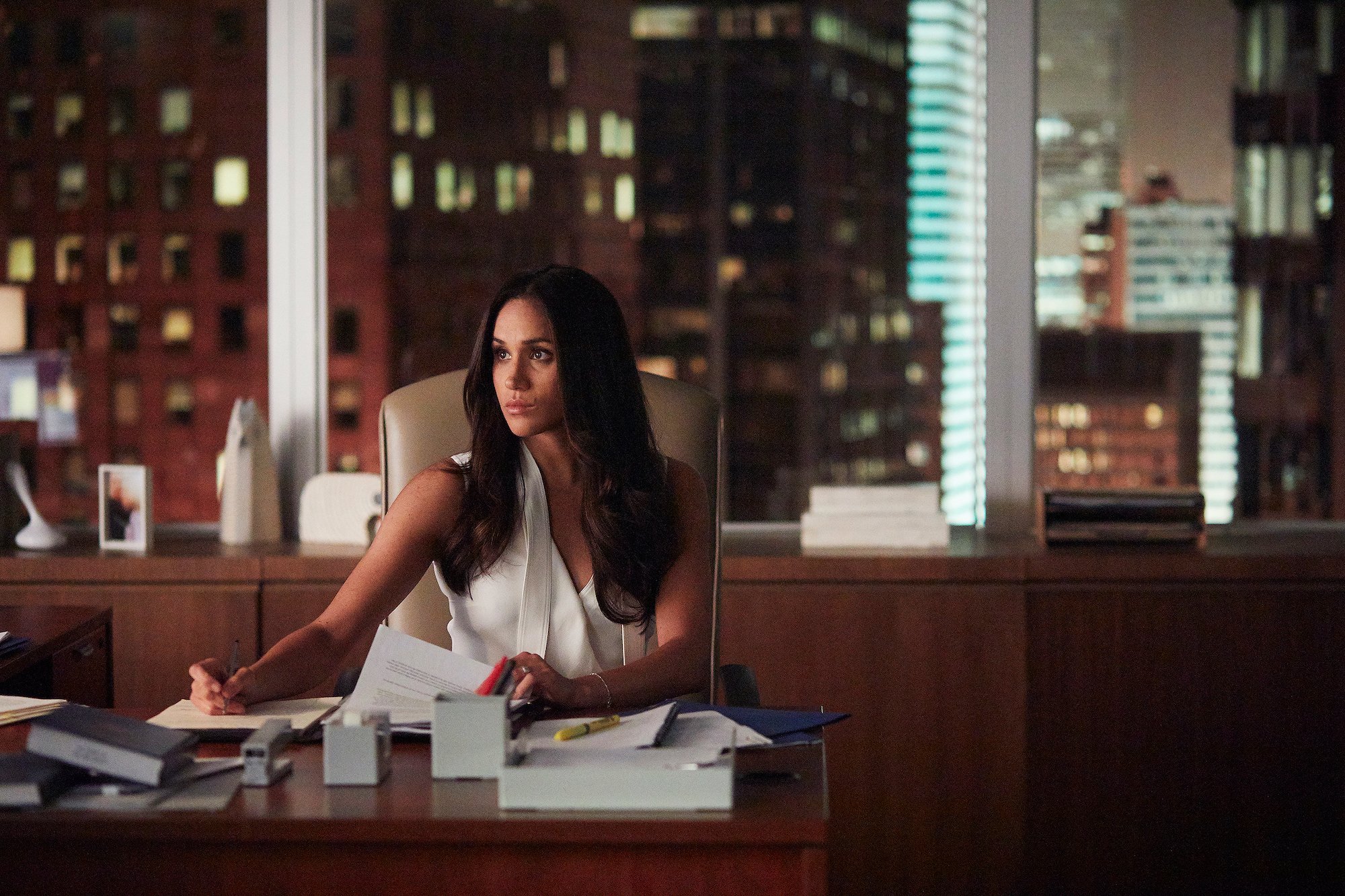 Meghan Markle's 'Suits' character Rachel Zane in front of a cityscape