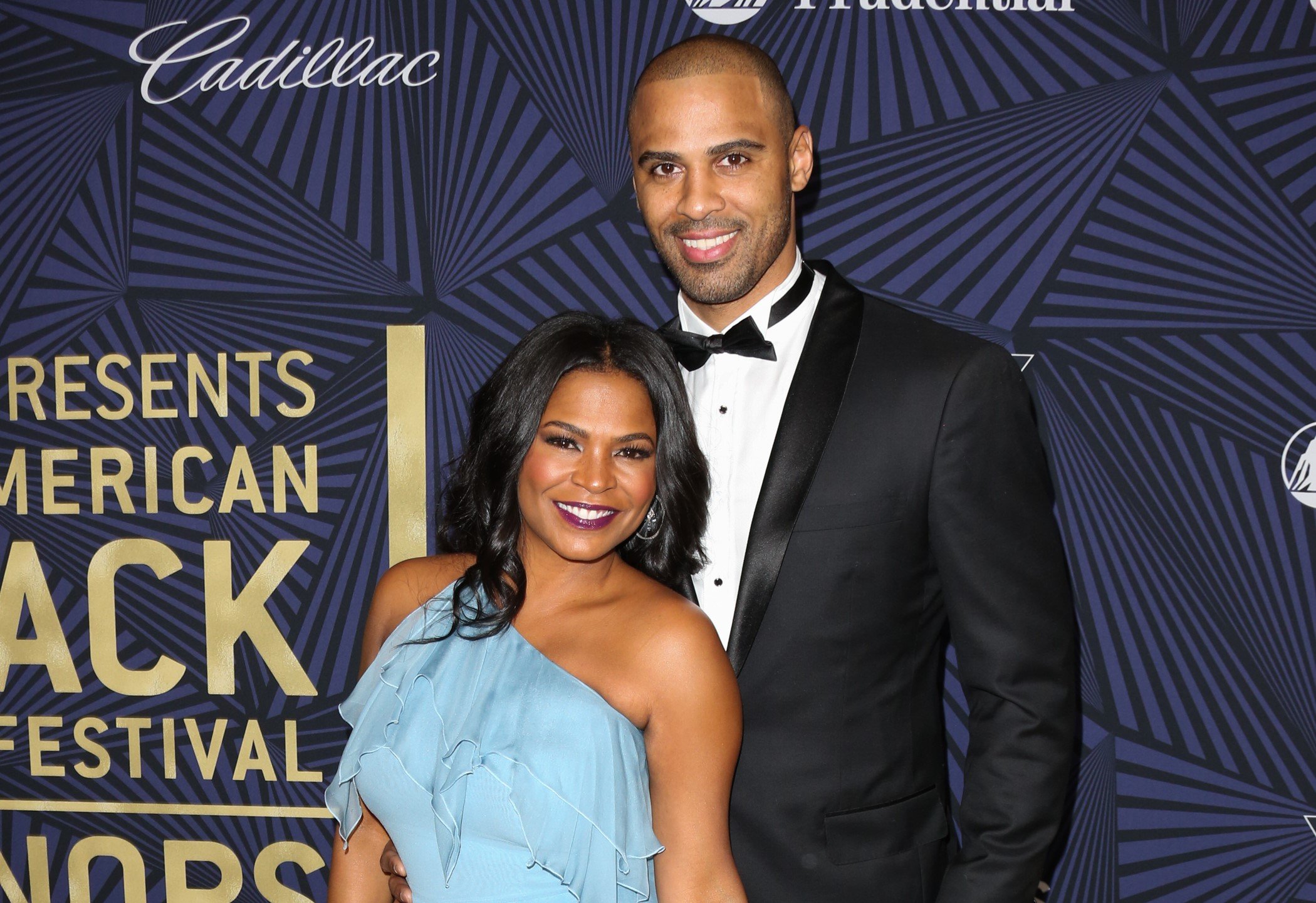 Nia Long and Ime Udoka pose for a photo together on carpet at the BET Awards