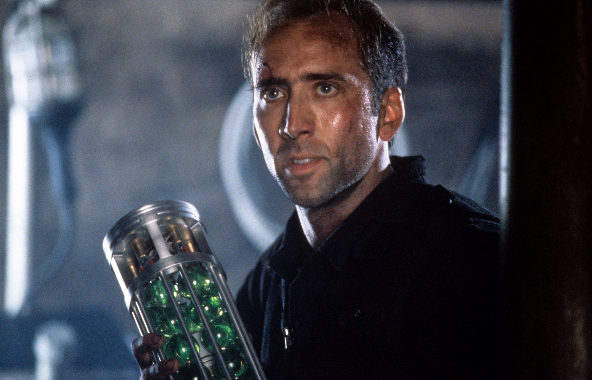 Nicolas Cage holds the rocket in The Rock