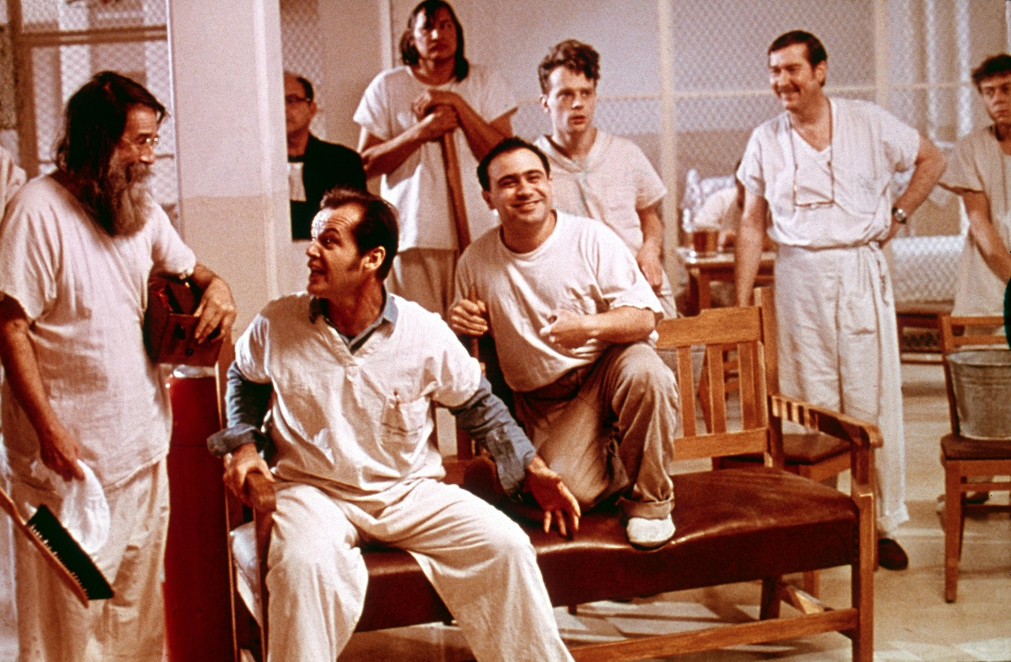 A scene from 'One Flew Over the Cuckoo's Nest' where the cast sits around a common room