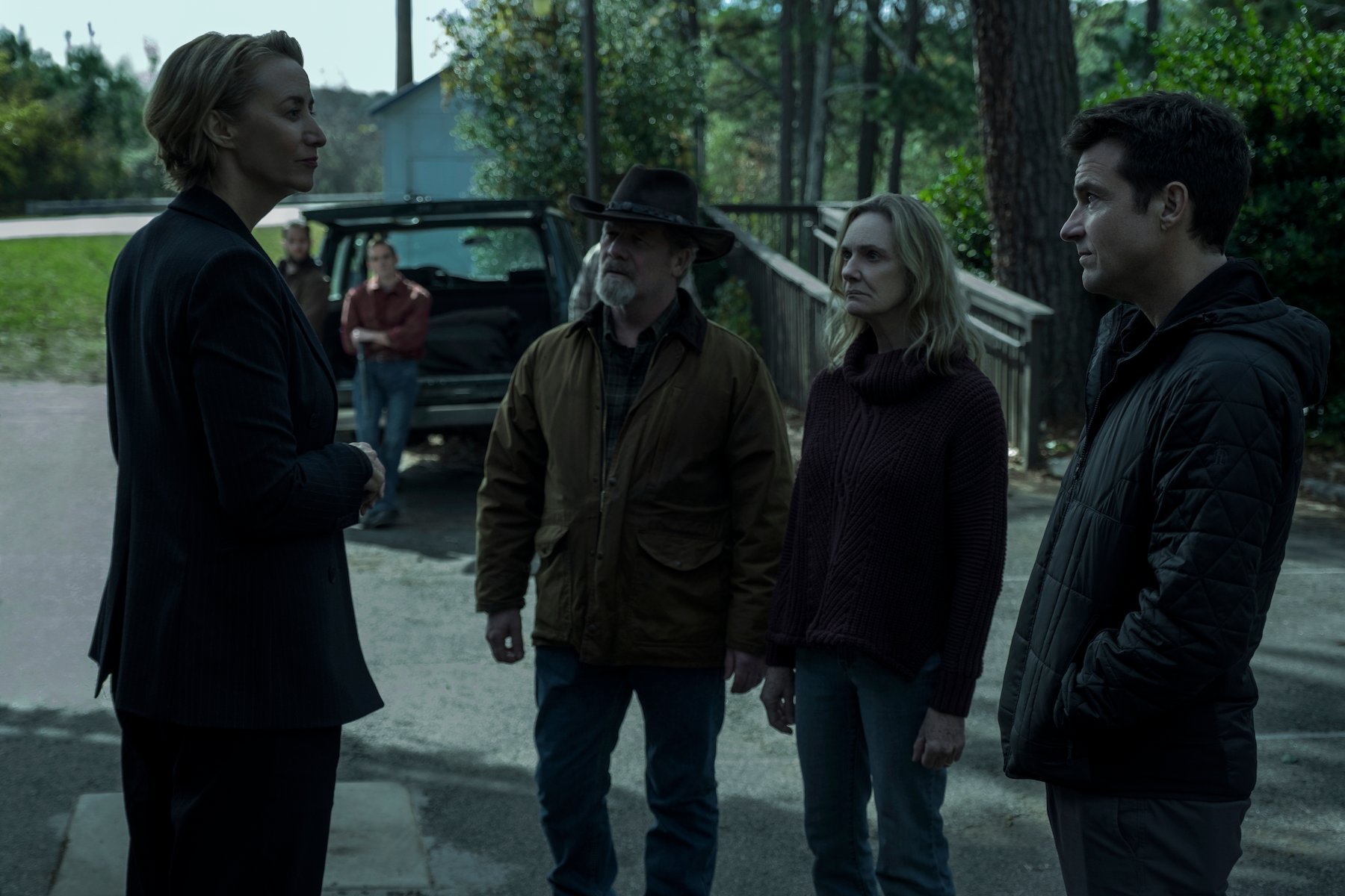 Janet McTeer as Helen Pierce, Peter Mullan as Jacob Snell, Lisa Emery as Darlene Snell, and Jason Bateman as Marty Byrde standing together in 'Ozark'