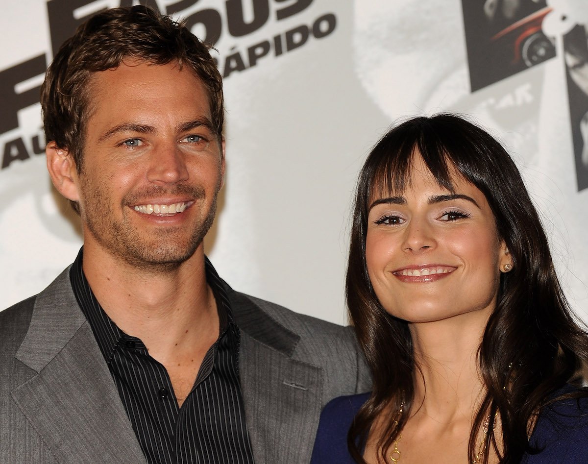 Paul Walker and Jordana Brewster smile while standing next to each other at 'Fast and Furious' photocall