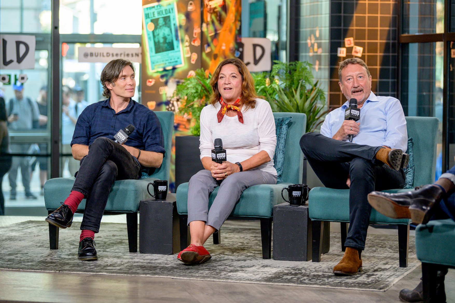 Cillian Murphy, Caryn Mandabach, and Steven Knight, actors and creators of 'Peaky Blinders' Season 6, sitting on a couch to discuss 'Peaky Blinders' with the Build Series