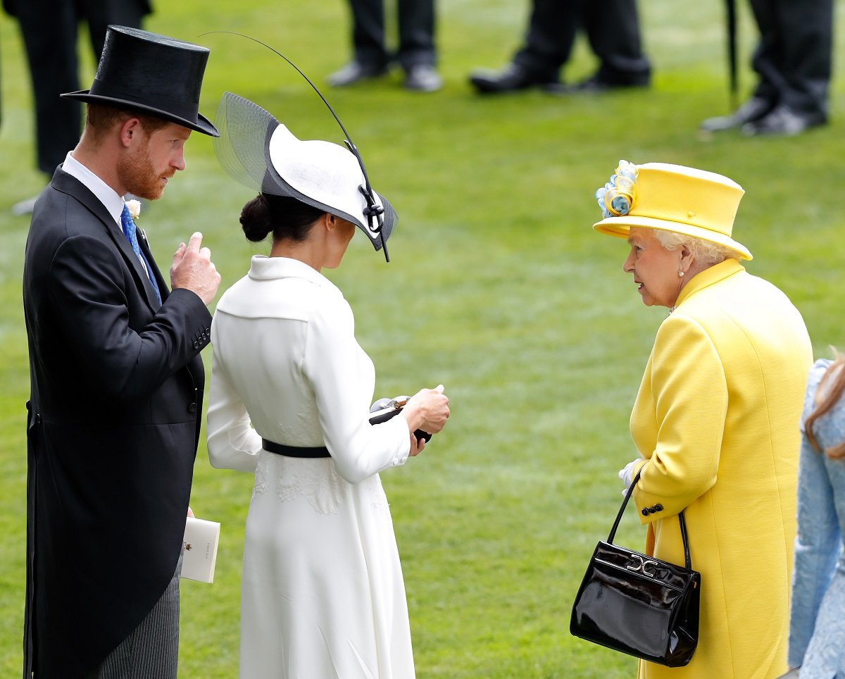 Prince Harry, Meghan Markle, and Queen Elizabeth II attending Day 1 of Royal Ascot