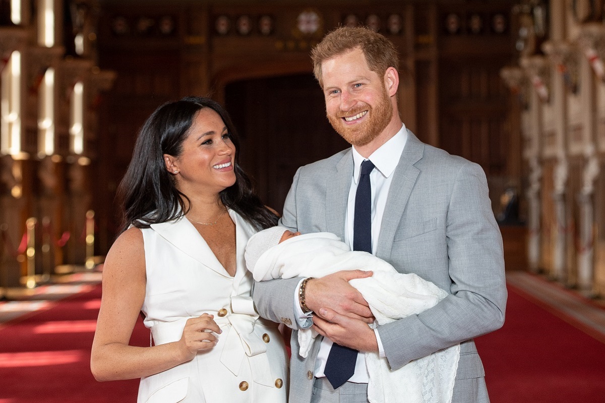 Prince Harry and Meghan Markle pose with their son Archie Harrison Mountbatten-Windsor during a photocall days after his birth