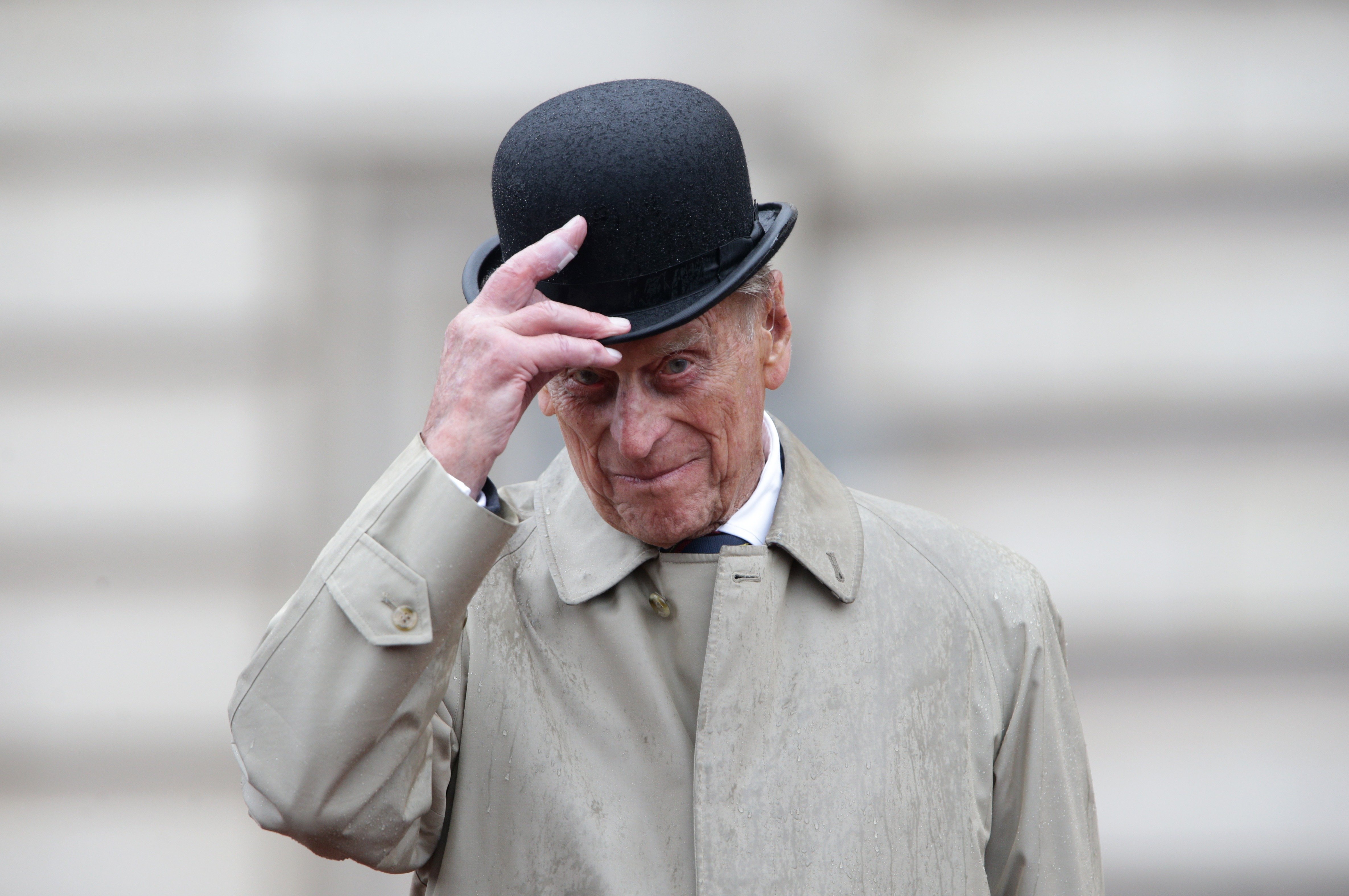 Prince Philip, Duke of Edinburgh raises his hat in his role as Captain General, Royal Marines