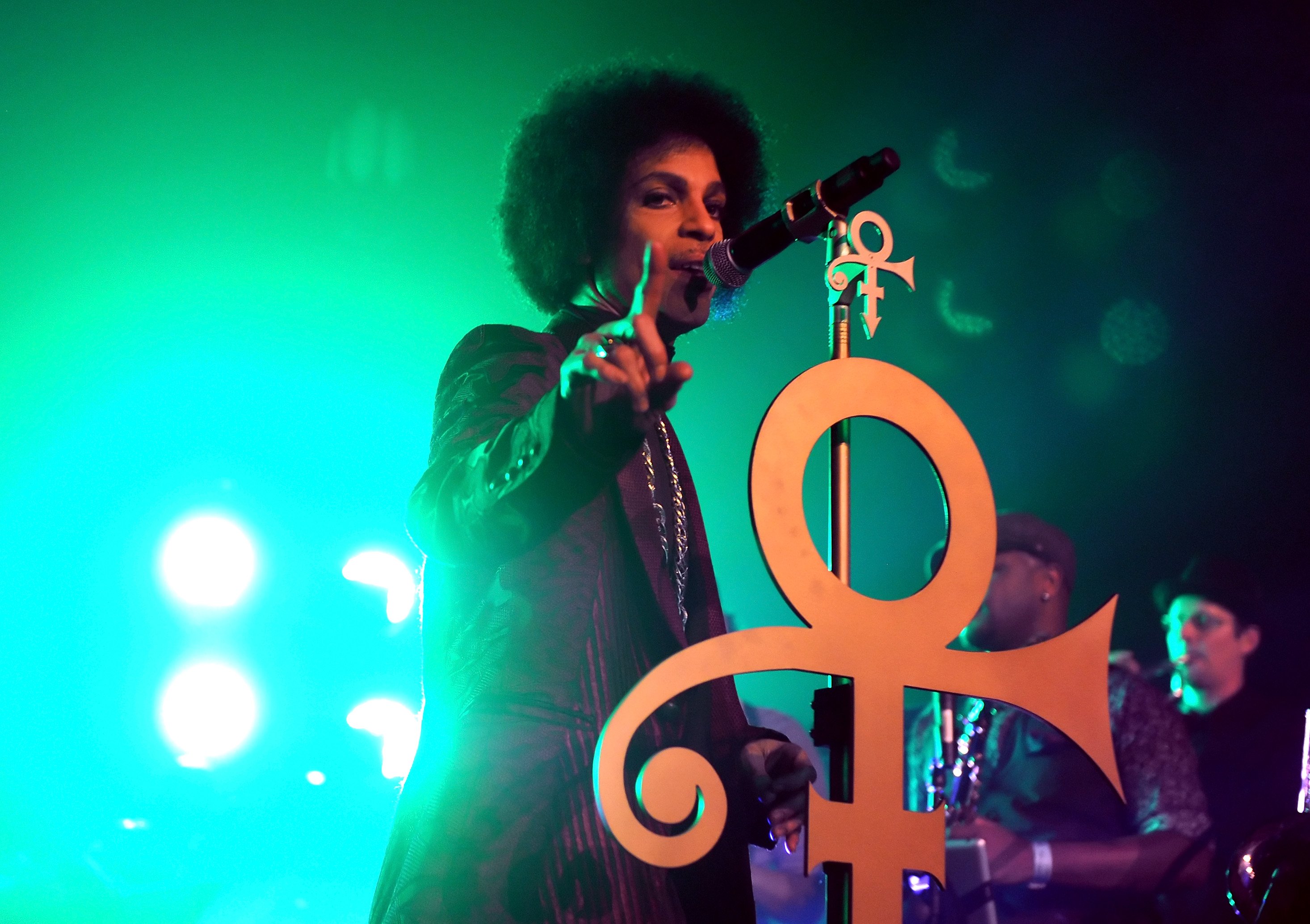 Prince singing onstage at The Hollywood Palladium in 2014