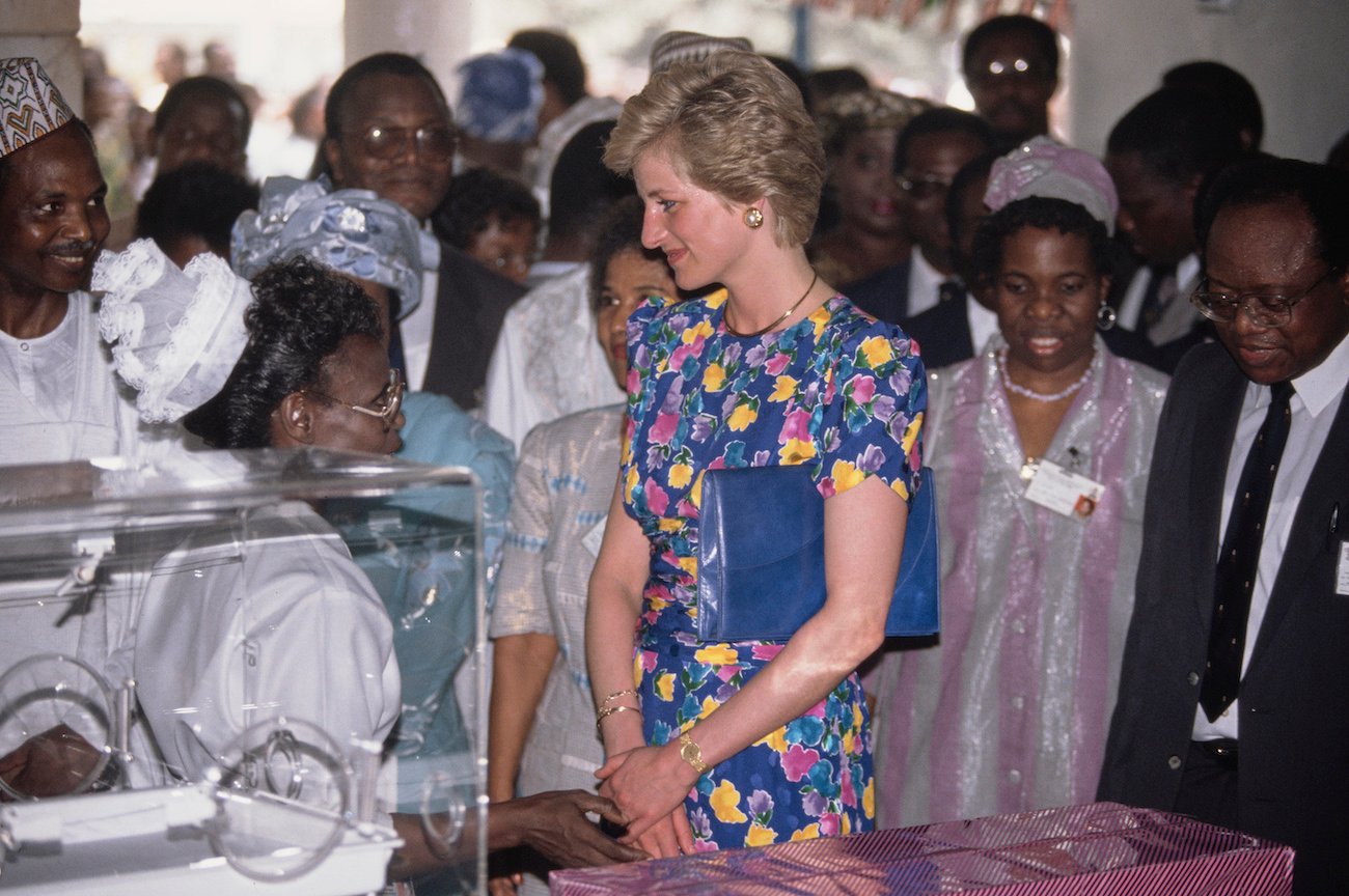 Princess Diana talking to nurses in special blue dress