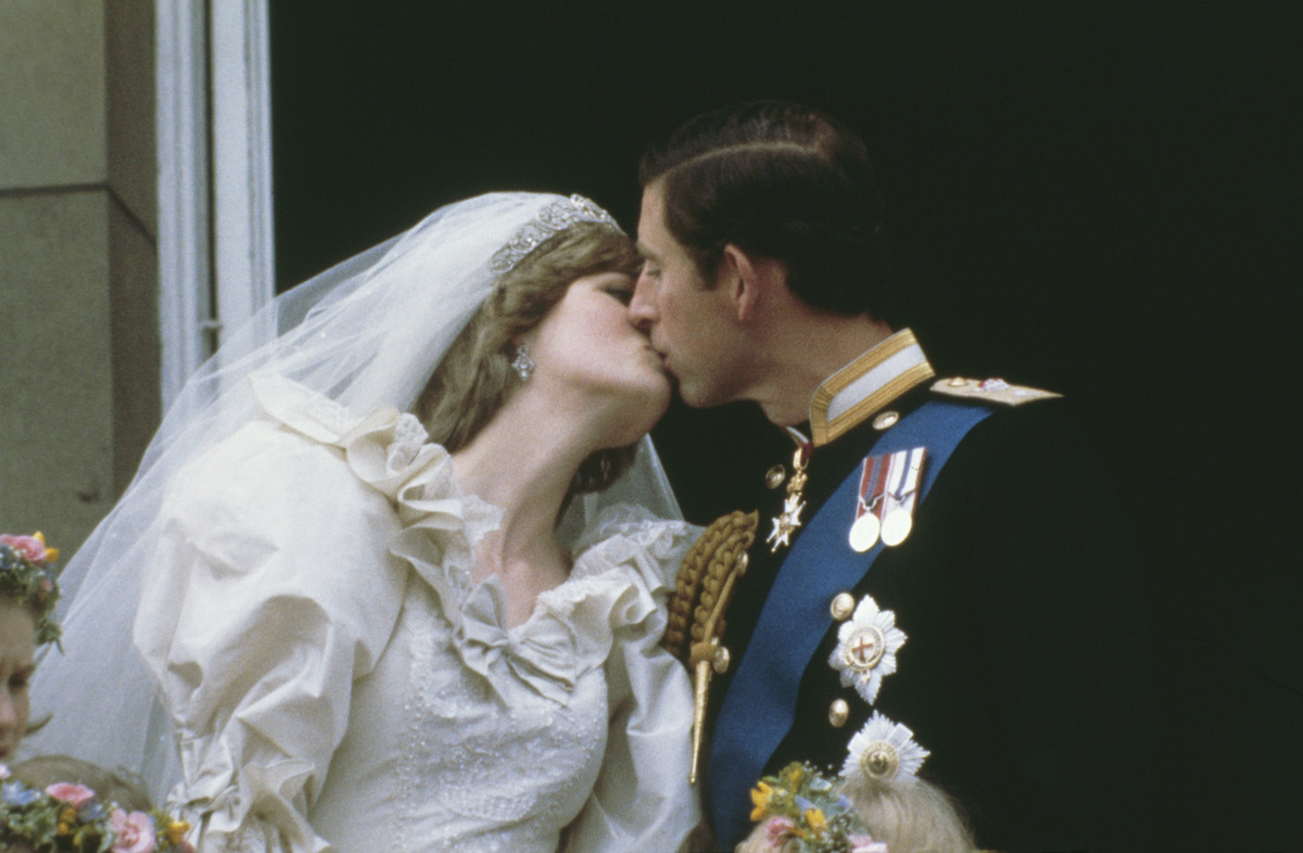 (L-R) Princess Diana and Prince Charles kissing on their wedding day