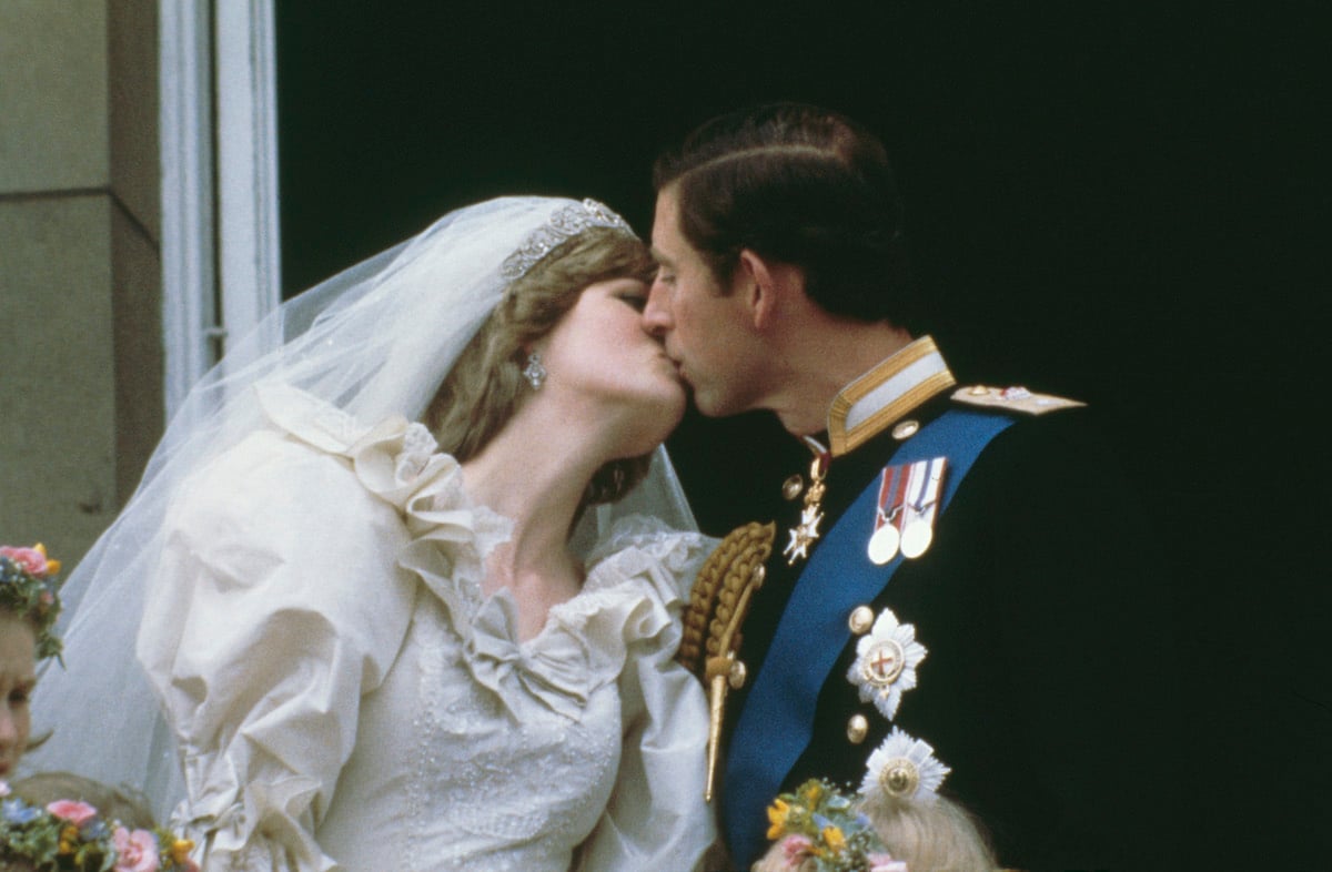 (L-R) Princess Diana and Prince Charles kissing on their wedding day