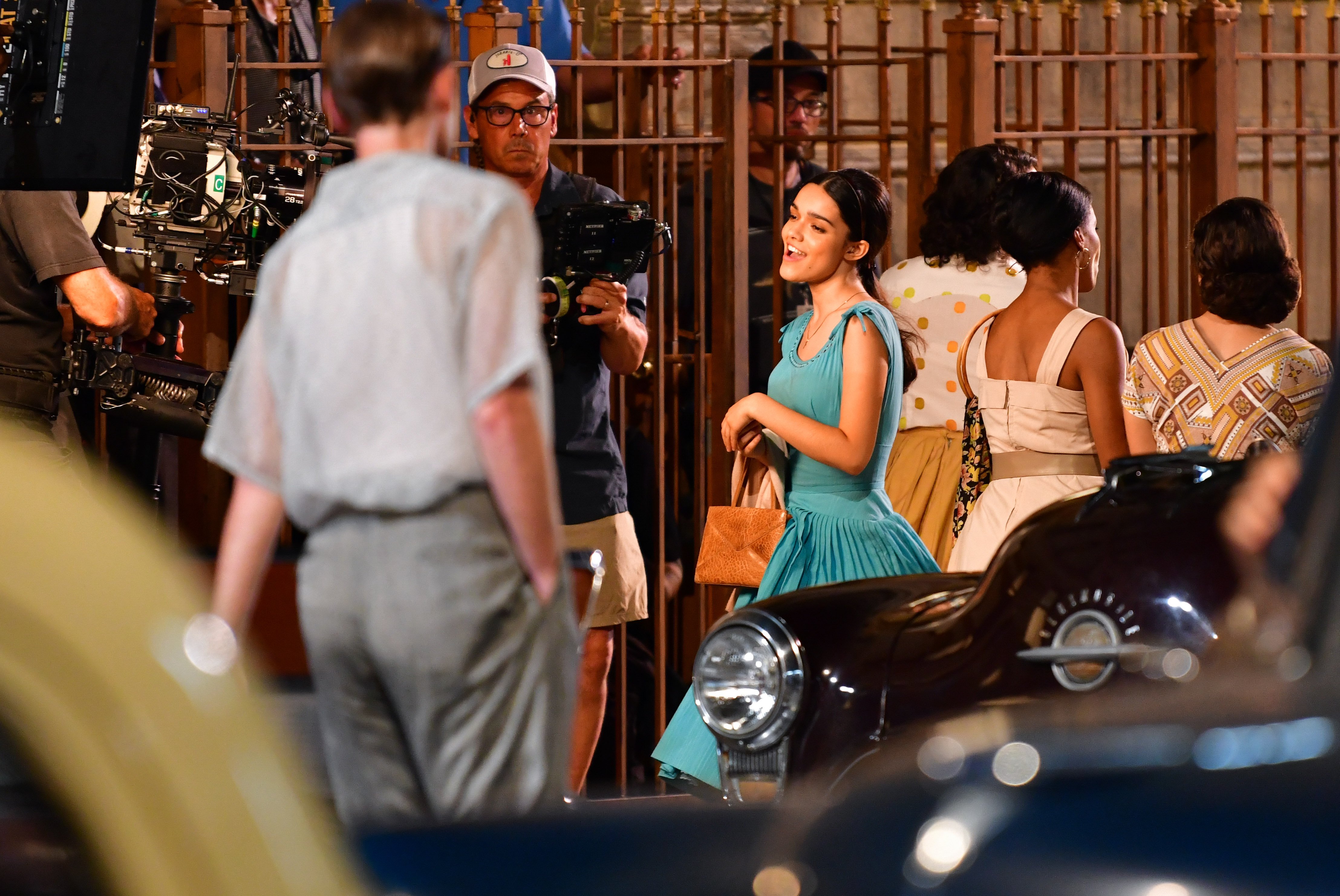 Rachel Zegler seen on location for 'West Side Story,' singing in a blue dress