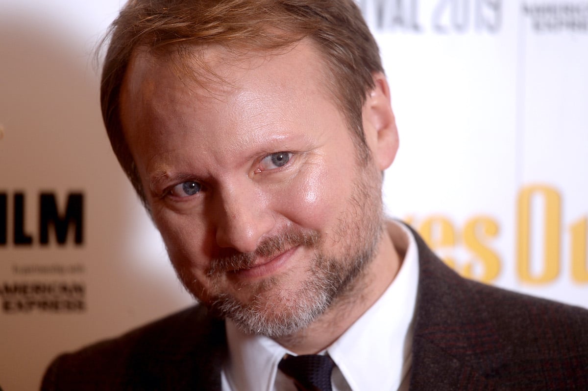 Rian Johnson smiles and poses at the 'Knives Out' European premiere