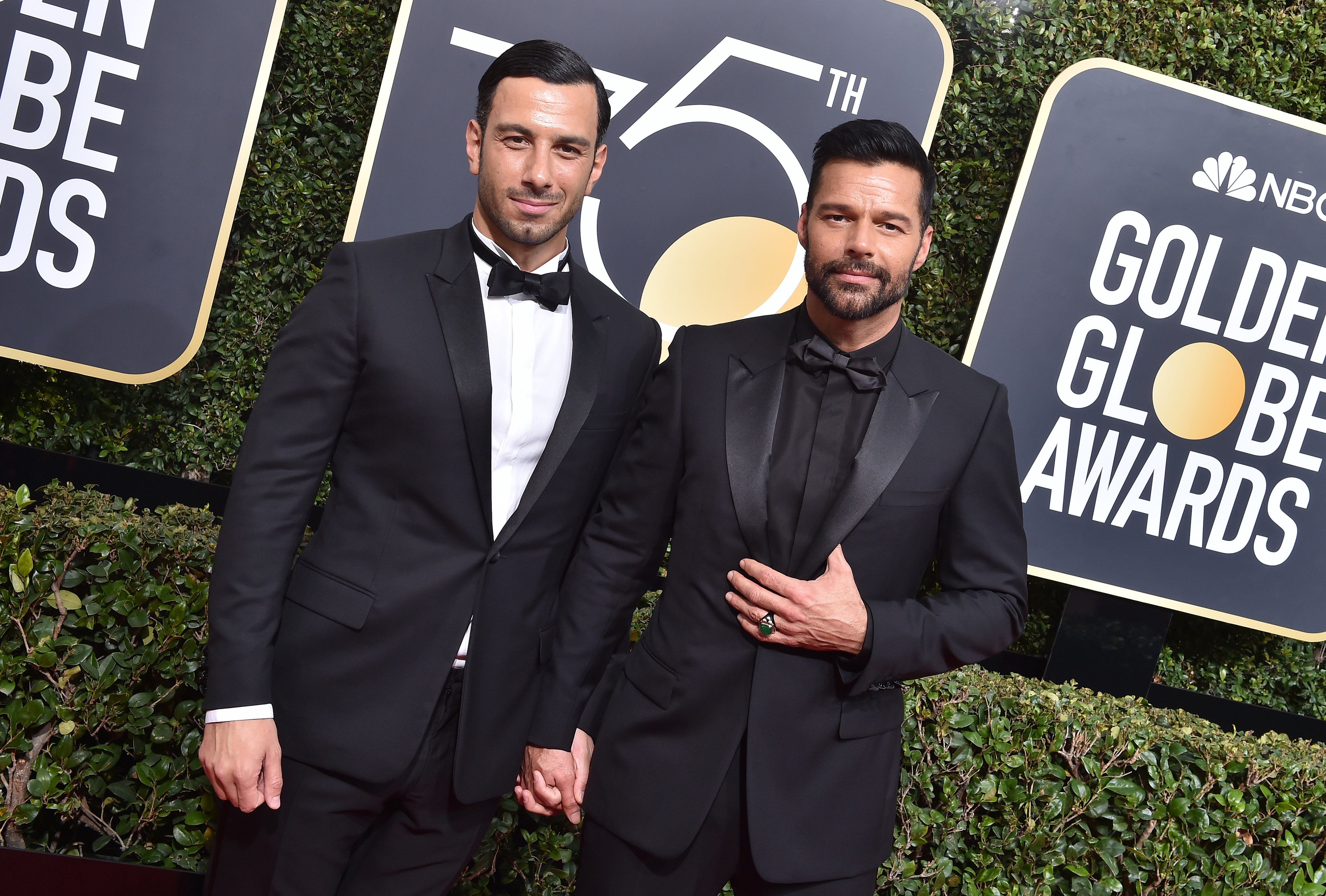 Ricky Martin and his spouse Jwan Yosef holding hands on the red carpet at the 75th Annual Golden Globe Awards