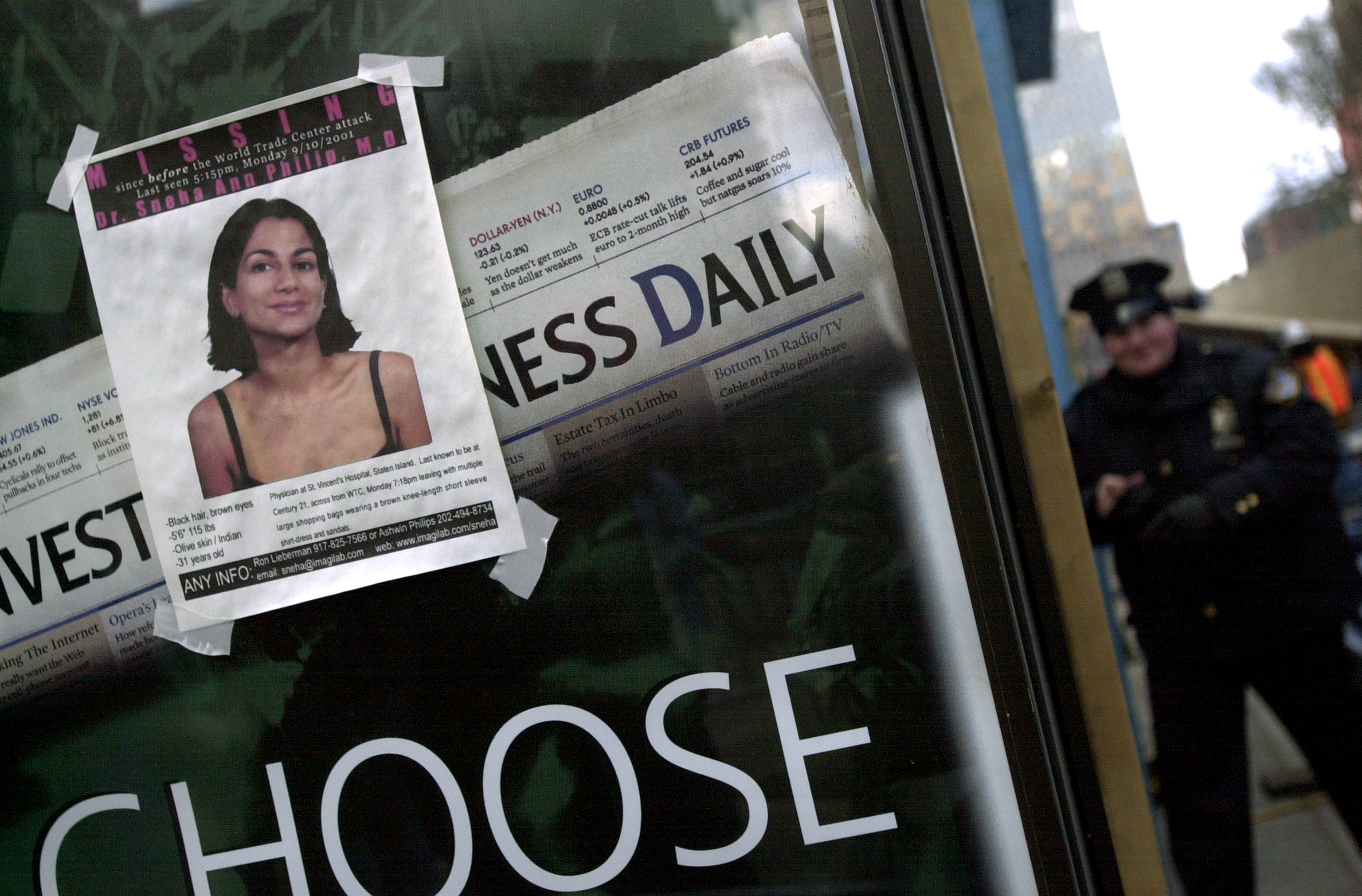 A missing poster featuring Doctor Sneha Anne Philip is seen near the site of the World Trade Center