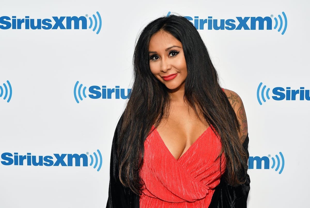 Nicole 'Snooki' Polizzi smiles at the camera; the reality star from 'Jersey Shore: Family Vacation' who has several tattoos