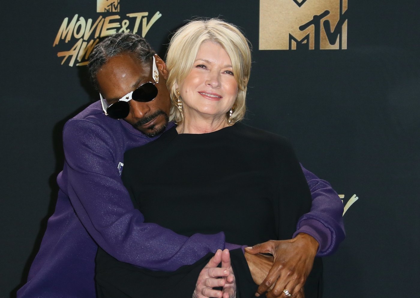 Snoop Dogg and Martha Stewart pose in the press room at the 2017 MTV Movie and TV Awards in May 2017 in Los Angeles