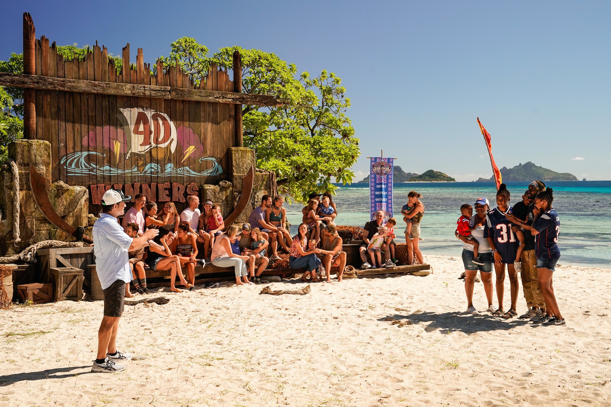 Jeff Probst, the host of 'Survivor' Season 41, on the beach with the players of 'Survivor: Winners at War' 