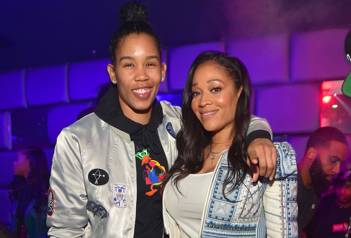 Tamera Young and Mimi Faust hugging as they pose for a photo together at a party in 2018